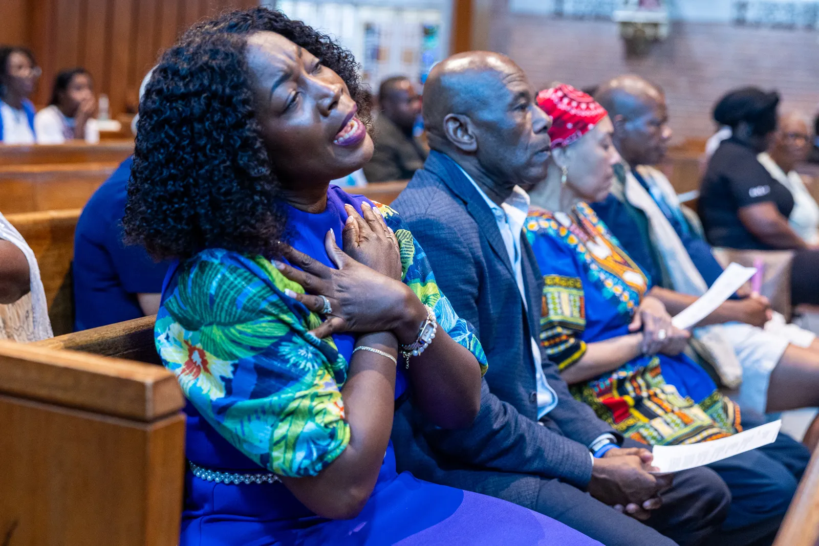 A woman sings at Our Lady of Sorrows Church in Takoma Park, Maryland, on July 28, 2026 during a Mass of Solidarity with the Haitian community and those impacted by changes to immigration policy. (Catholic Standard photo by Mihoko Owada)