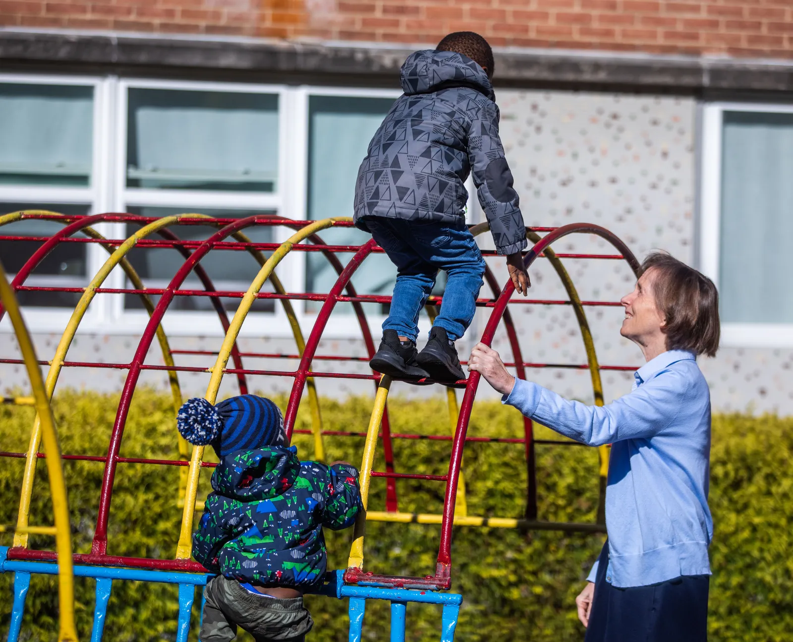 In a 2019 photo, Daughter of Charity Sister Mary Bader, then the CEO of St. Ann’s Center for Children, Youth and Families in Hyattsville, Maryland, plays with children there. (Catholic Standard photo by Andrew Biraj)