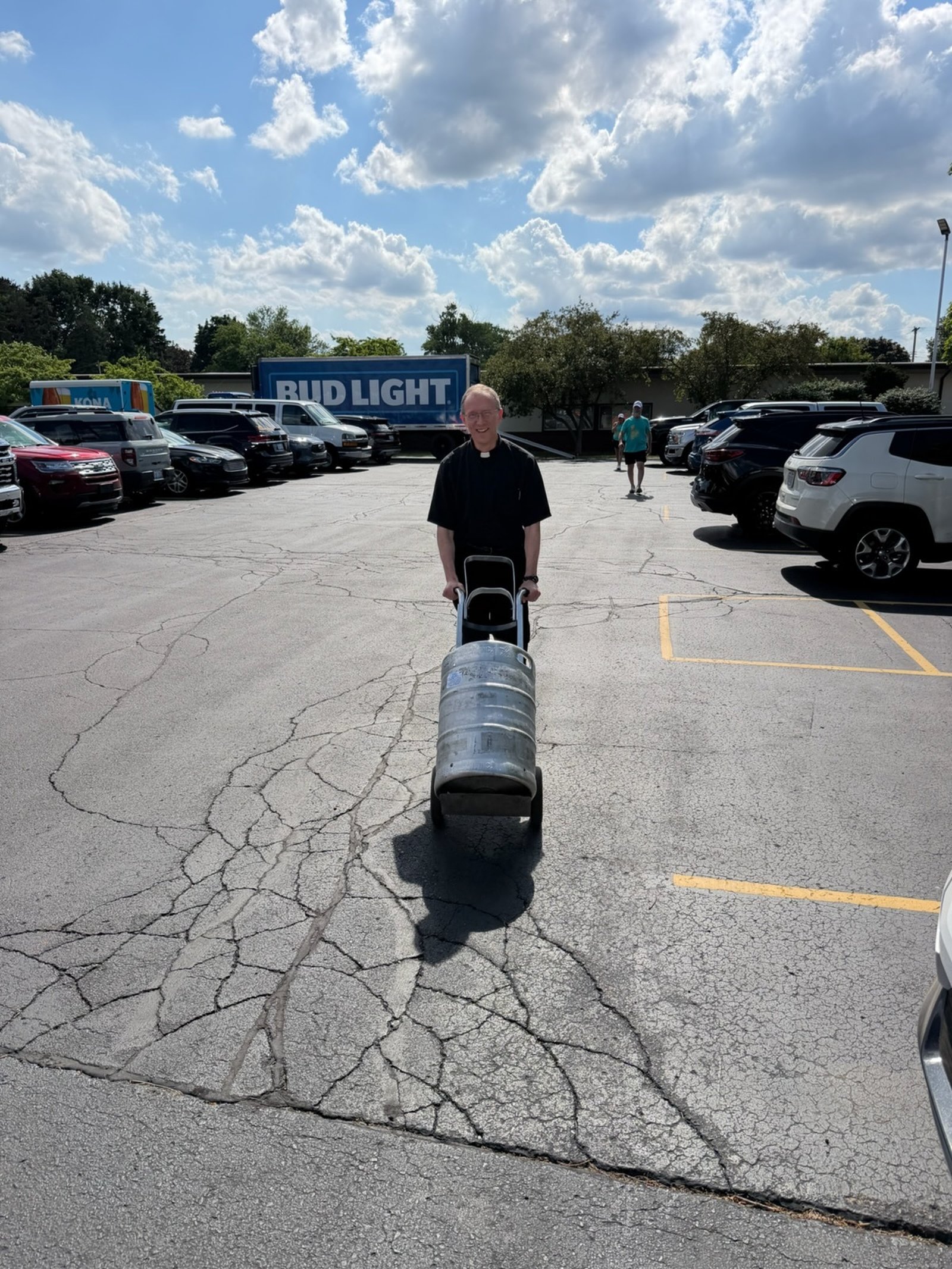Like a good shepherd, Fr. Herman volunteers to help in a very “hands-on” way.