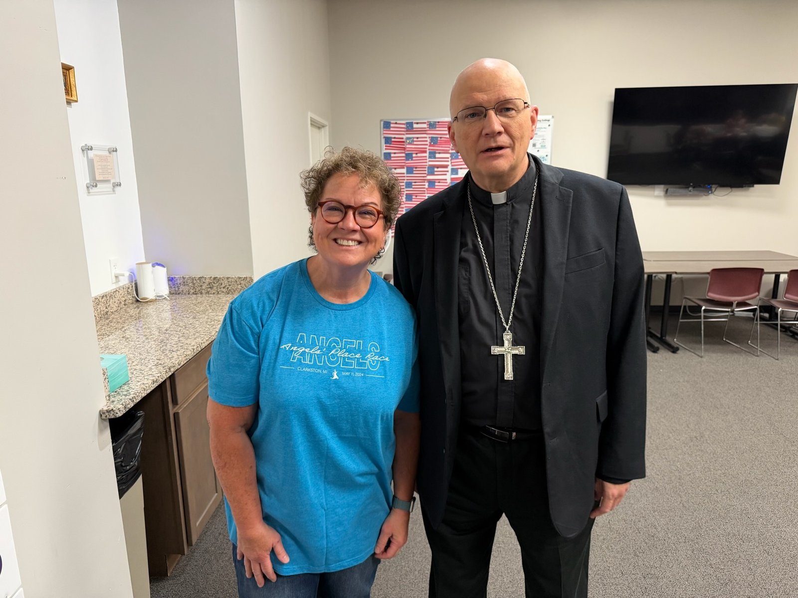 Archbishop Weisenburger is pictured with Karen MacDonald, director of resident enrichment at Angels' Place, which includes academics, music, spiritual development, arts, and crafts, and other services and activities for residents.