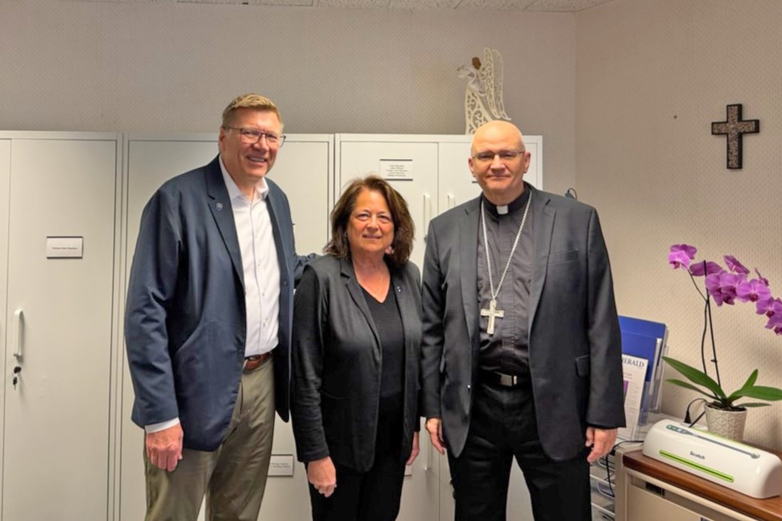 Archbishop Weisenburger is pictured with Tom Szczepamski, executive director, and Barbara Urbiel, chief development officer at Angels' Place.