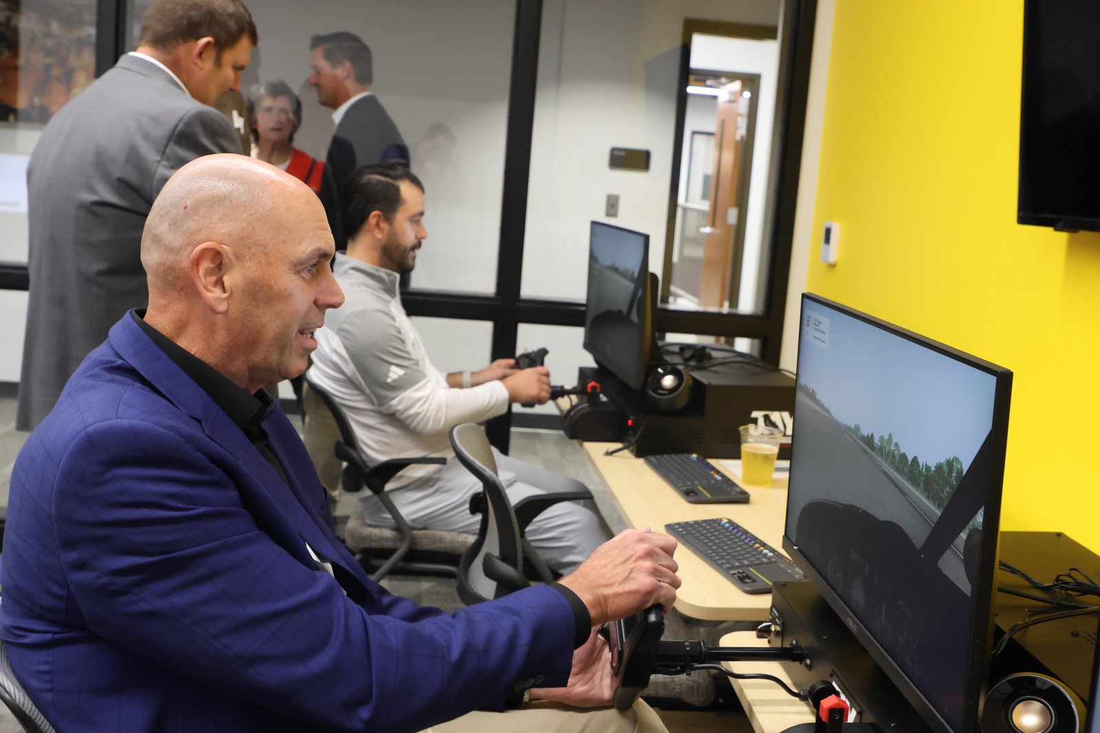 Guests test out the new flight simulators in the STEM center.