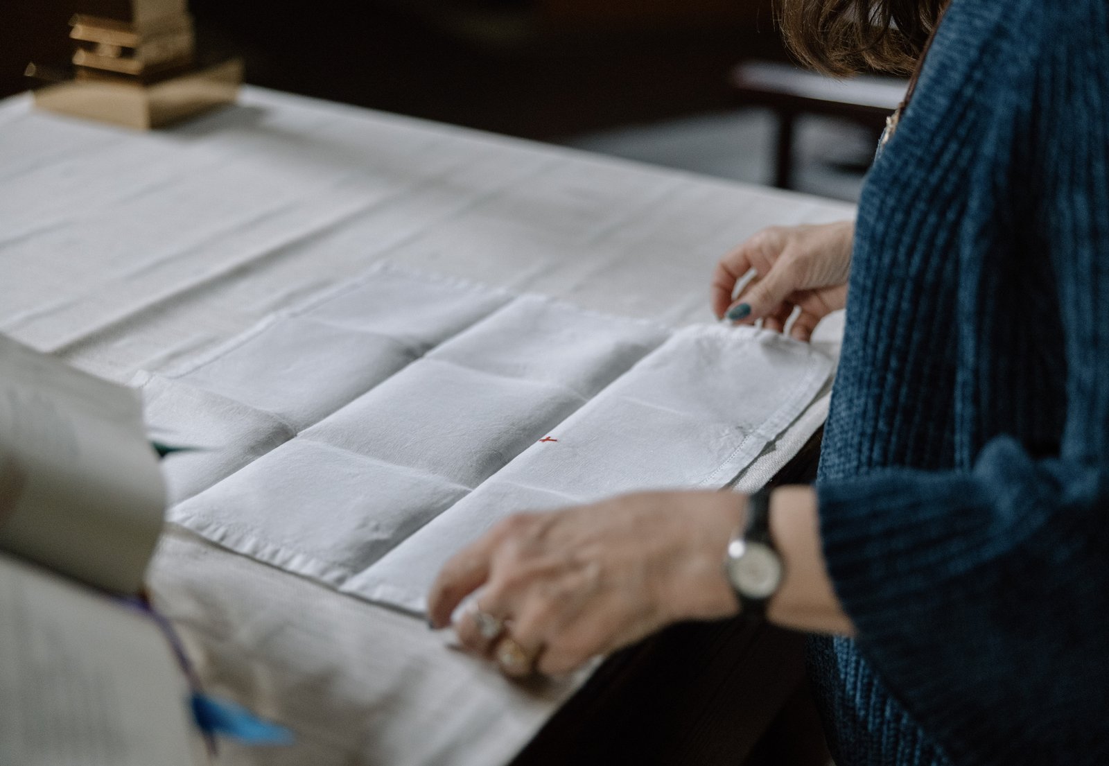 Wilson helps fold altar linens in preparation for Mass. In addition to keeping the church beautiful, Wilson also hosts an annual Lenten towel drive, collecting hundreds of towels and washcloths to donate to Warren’s Turning Point Shelter for women who are victims of abuse and the Macomb County Rotating Emergency Shelter Team (MCREST).