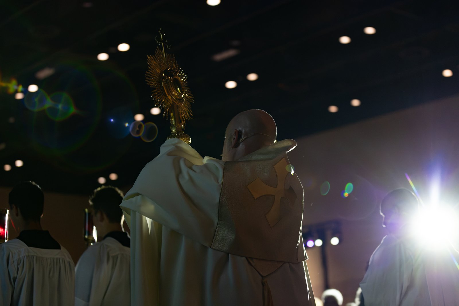 Fr. Joe Krupp, a priest of the Diocese of Lansing and a popular podcaster, columnist and speaker, holds the monstrance with the Blessed Sacrament exposed during Eucharistic adoration.