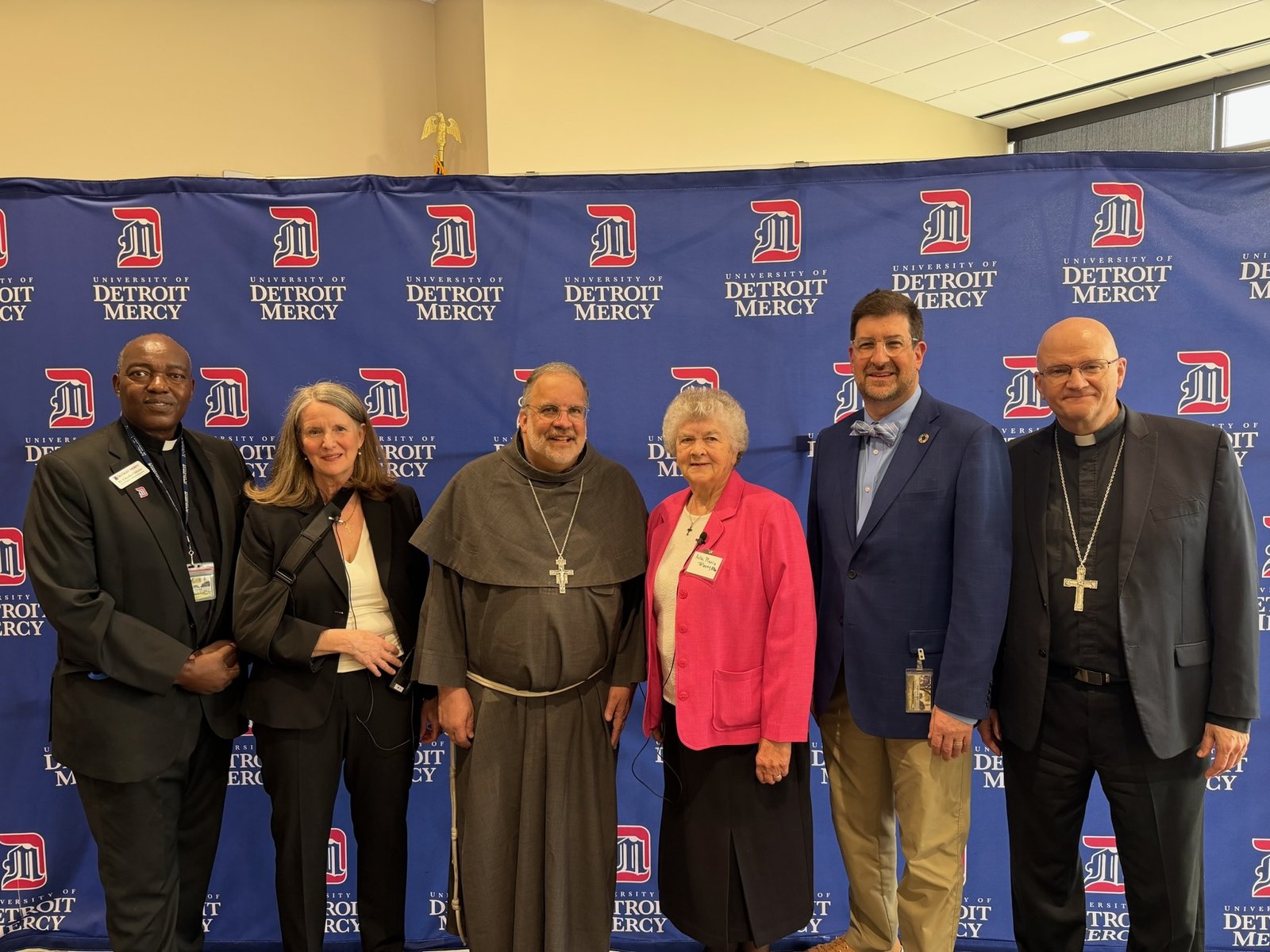 Left to right are Fr. Charles Oduke, SJ, the University of Detroit Mercy's vice president for mission integration; Bridget Deegan-Krause, M.Div., BCC, panel moderator, author and ministry leadership consultant; Lexington Bishop John Stowe, OFM Conv.; Sr. Helen Marie Burns, RSM, university board member and former president of the Leadership Conference of Women Religious; Matt Mio, Ph.D., chairman and longtime professor of chemistry and biochemistry; and Detroit Archbishop Edward J. Weisenburger. (Photo by Joe Tremblay | Special to Detroit Catholic)
