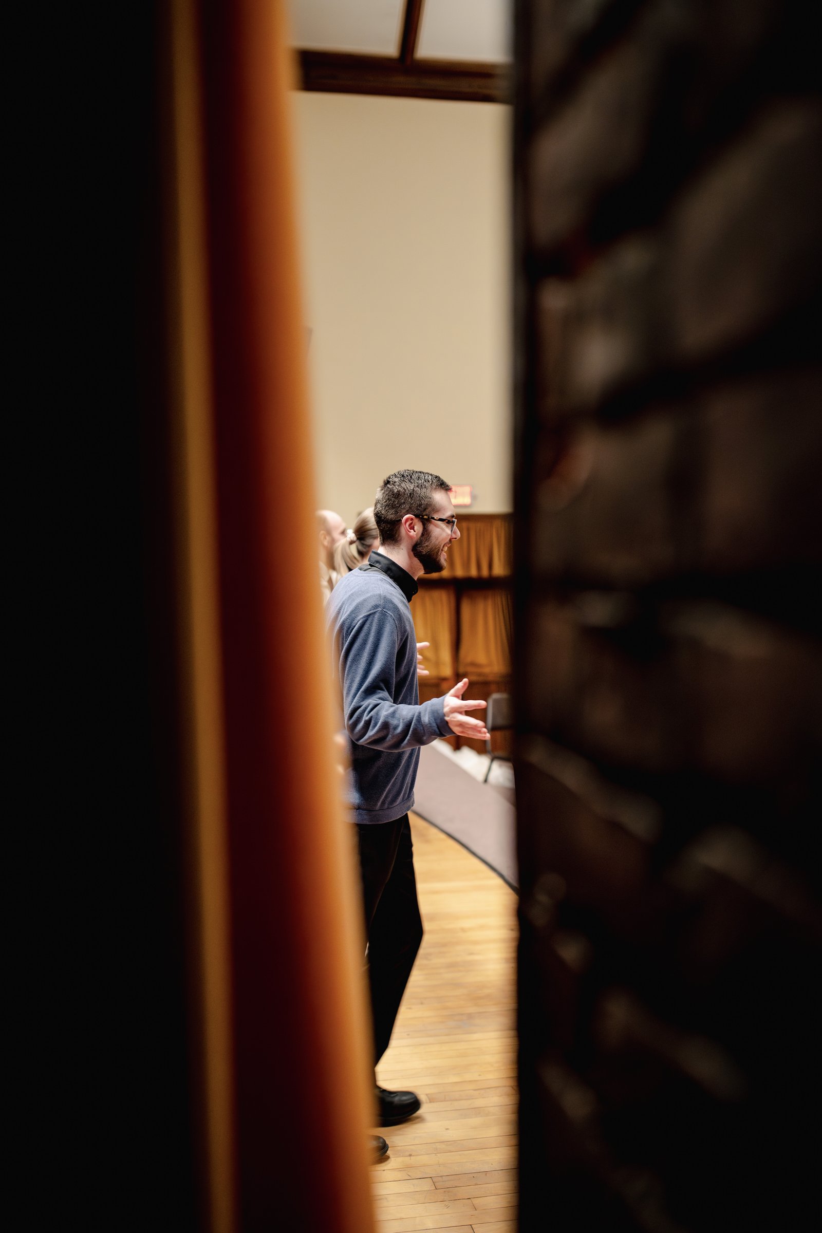 Seminarians rehearse musical numbers from "The Bluff" inside Sacred Heart's 100-year-old auditorium.