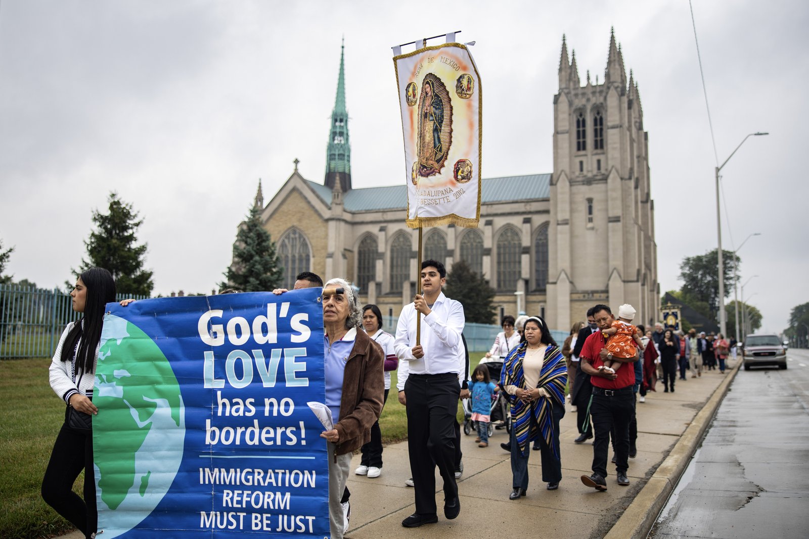Detroit-area Catholics carry banners in a procession following Mass for the 110th World Day of Migrants and Refugees in September 2024 at the Cathedral of the Most Blessed Sacrament in Detroit. Archbishop Weisenburger has invited Catholics to take part in a special Mass this year hosted by Strangers No Longer on Oct. 4 at 2:30 p.m. (Photo by Valaurian Waller | Detroit Catholic)
