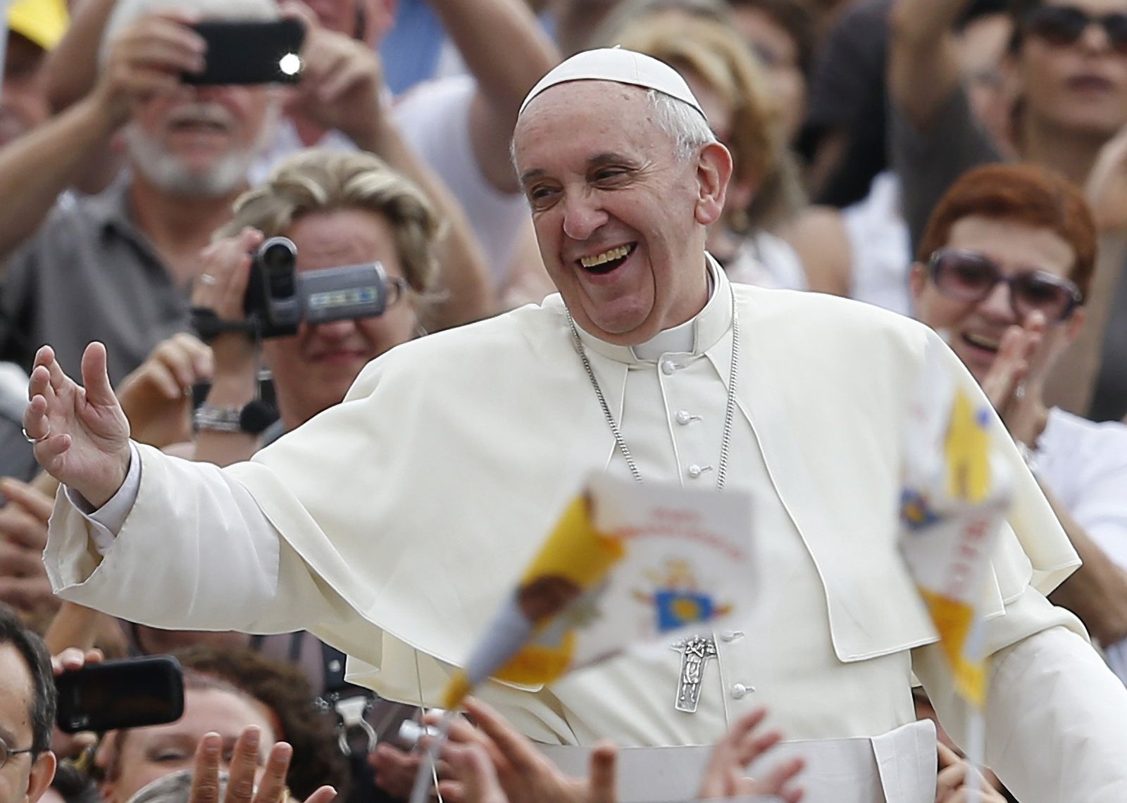 Pope Francis greets the crowd as he arrives to lead his general audience in St. Peter's Square at the Vatican Sept. 11, 2013. (CNS photo/Paul Haring)