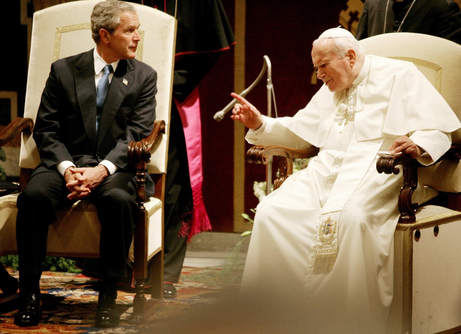 U.S. President George W. Bush listens as Pope John Paul II makes a point at the end of their meeting at the Vatican June 4, 2004. It was their first meeting since the Iraq war. The pope told Bush he was deeply concerned about the "grave unrest" in Iraq. (CNS photo/Reuters)