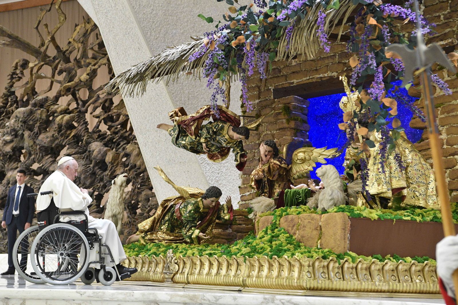 Pope Francis visits a Nativity scene in the Paul VI hall at the Vatican on Dec. 3, 2022. Catholics may receive a plenary indulgence this year during the Advent and Christmas seasons by praying before a Nativity scene in a Franciscan church, commemorating the 800th anniversary of St. Francis' creation of the modern Nativity scene and the establishment of the Franciscan order. (CNS photo/Vatican Media)