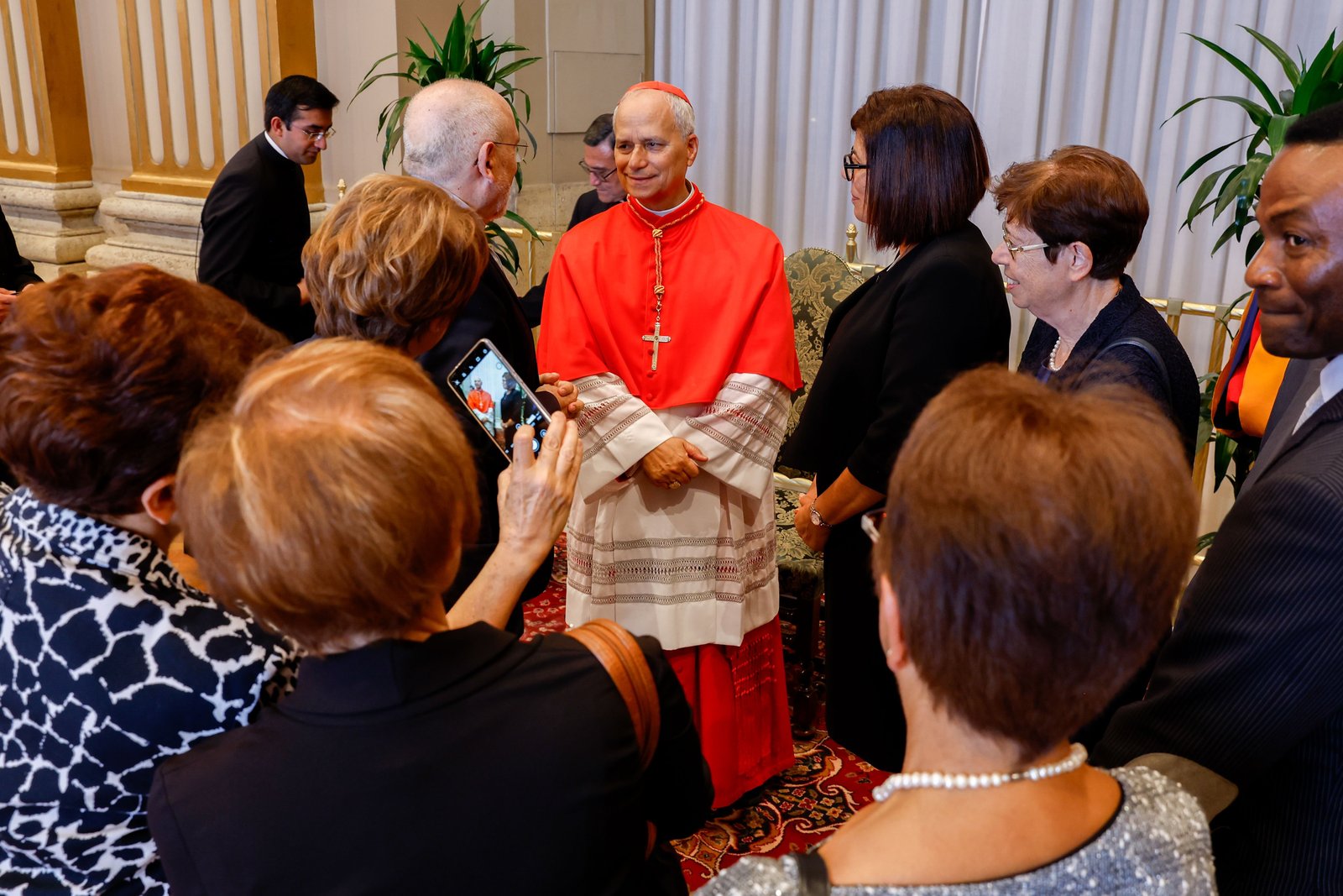Chicago-born Cardinal Robert F. Prevost, prefect of the Dicastery for Bishops, greets well-wishers in the Apostolic Palace at the Vatican after a consistory where Pope Francis made him and 20 other prelates cardinals Sept. 30, 2023. (CNS photo/Lola Gomez)