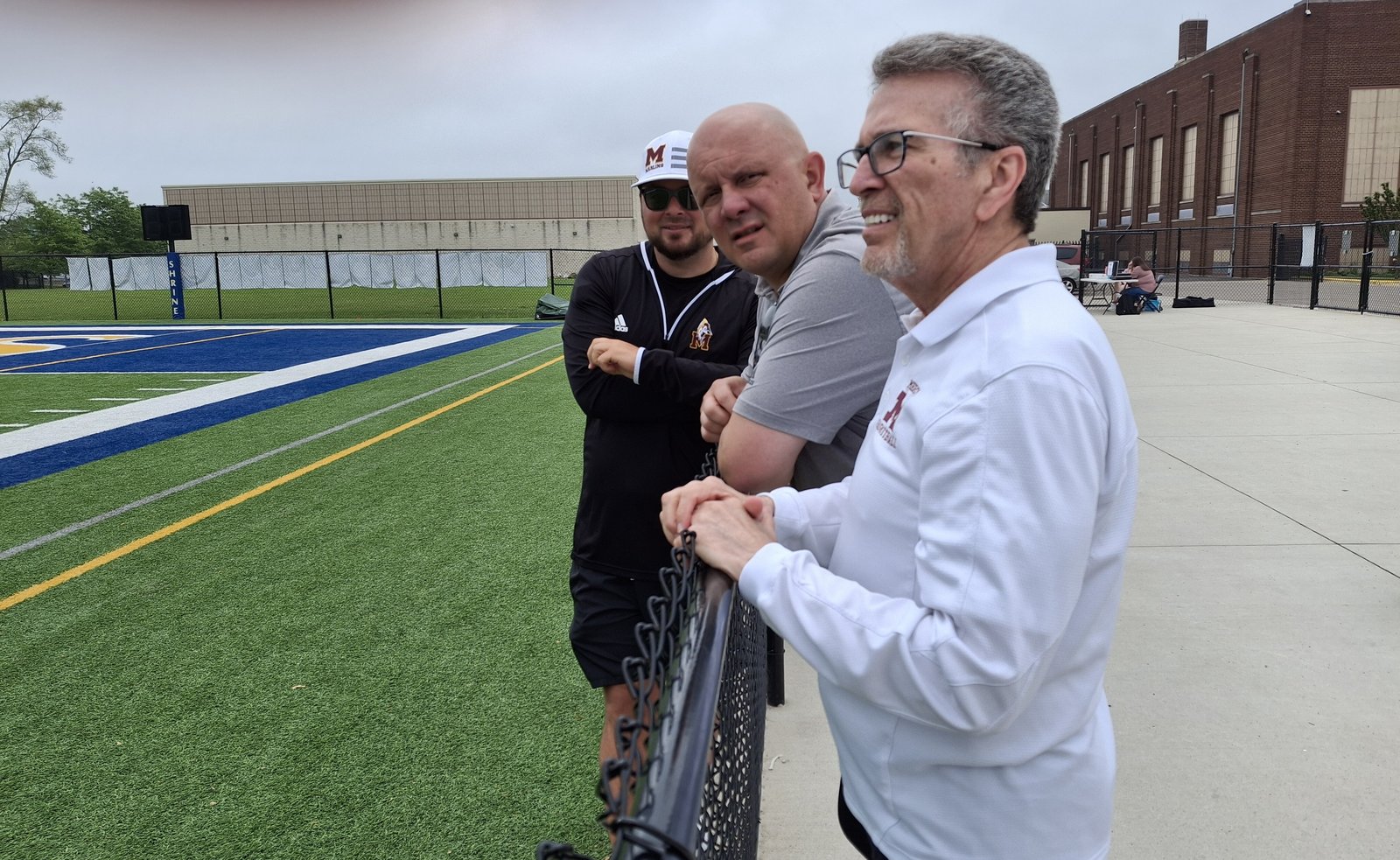 Mercy athletic director Brandon Malinowski (far left), CHSL associate director Mike Evoy and Mercy basketball coach Gary Morris shared a variety of opinions during the girls soccer championship games.