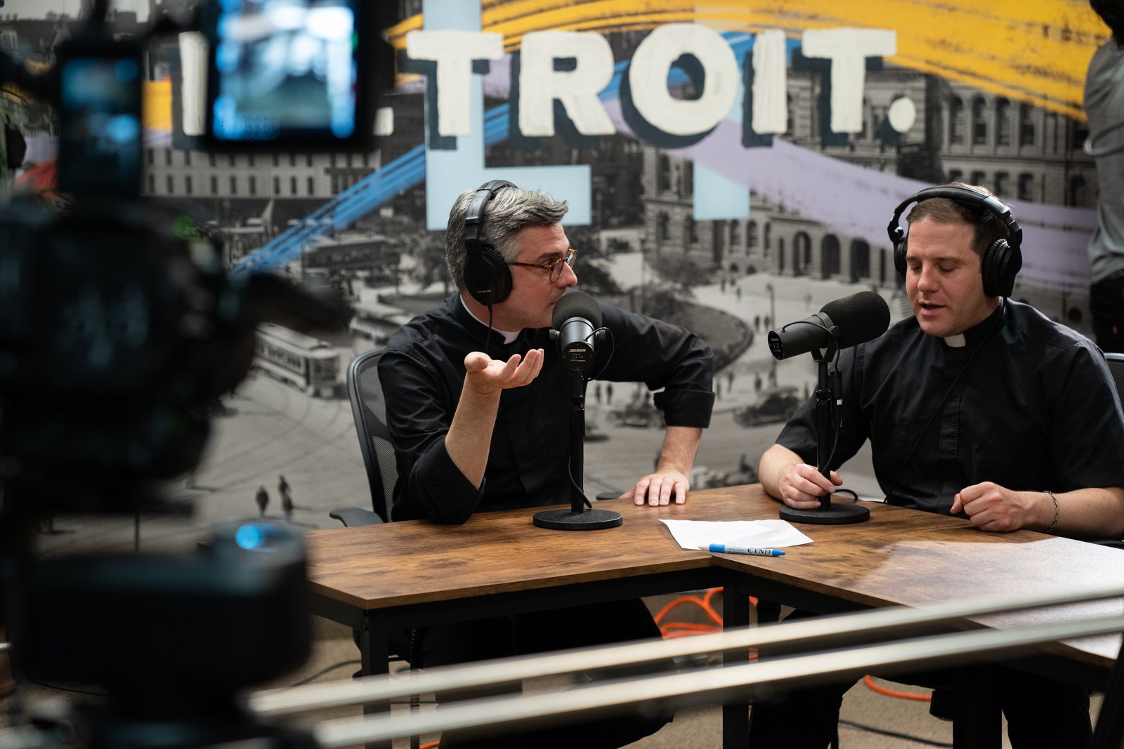 Fr. Brian Meldrum, left, and Fr. Matthew Hood host an Archdiocese of Detroit podcast, "Cinema Verbi," in which they discuss film through a Catholic lens. In their most recent episode, released May 6, they discuss the blockbuster 2024 movie "Conclave." (Valaurian Waller | Detroit Catholic)