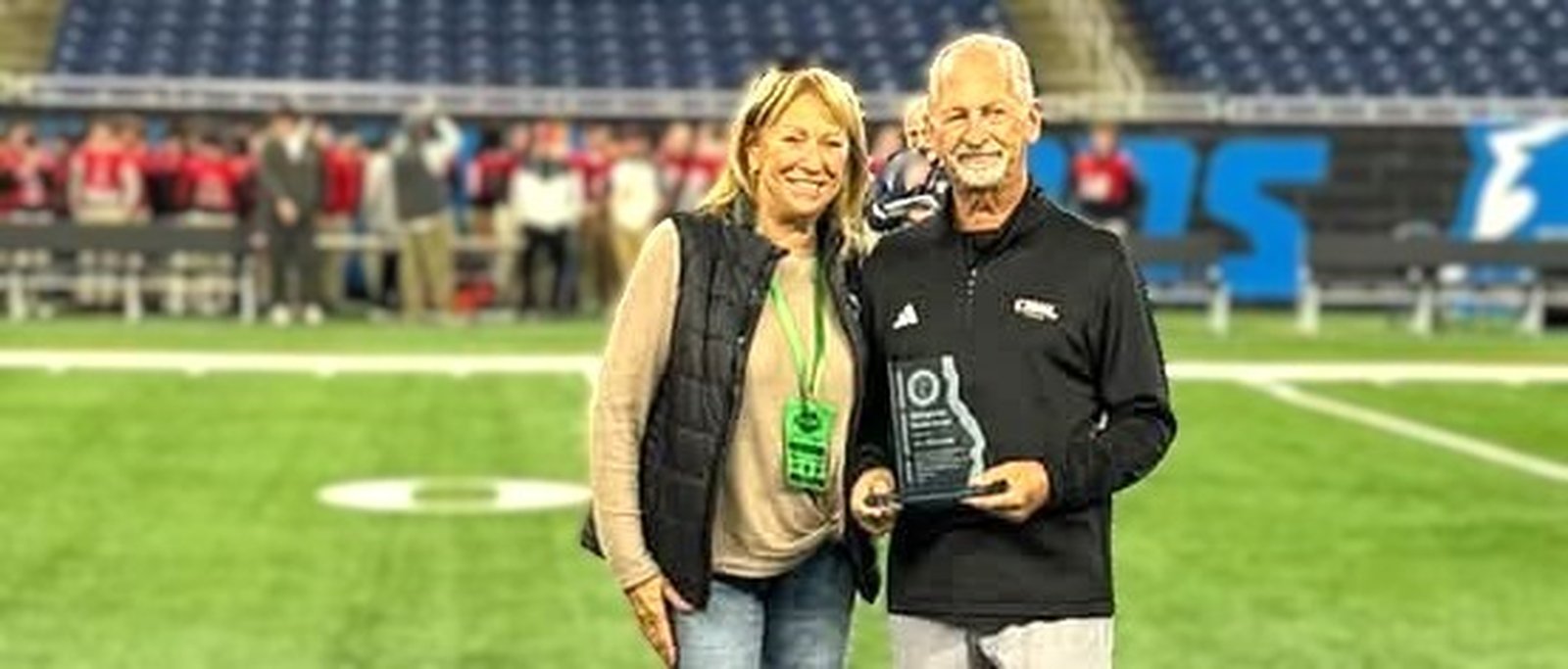 Vic Michaels was joined by his wife, Linda, at the CHSL Prep Bowl LIII celebrating the 2025 Jack Johnson Distinguished Service Award Vic received for significant contributions he has made to school and community as Director of the Catholic League.  (Photo courtesy of Mike McAndrews)