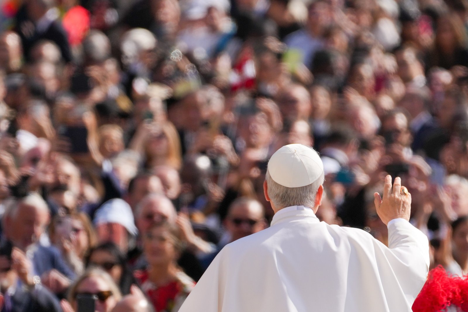 Pope Leo XIV greets the faithful while riding the popemobile through St. Peter's Square before celebrating his inauguration Mass at the Vatican May 18, 2025. (CNS photo/Lola Gomez)
