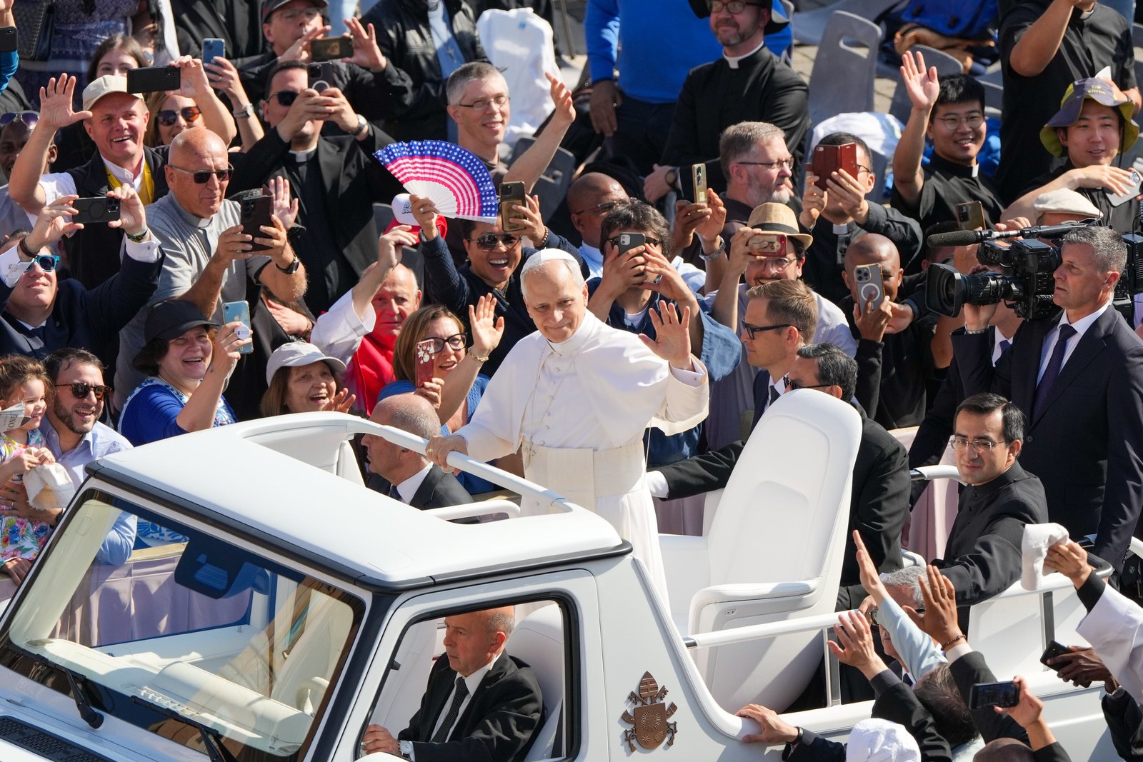 Pope Leo XIV greets the faithful while riding the popemobile through St. Peter's Square before celebrating his inauguration Mass at the Vatican May 18, 2025. (CNS photo/Lola Gomez)