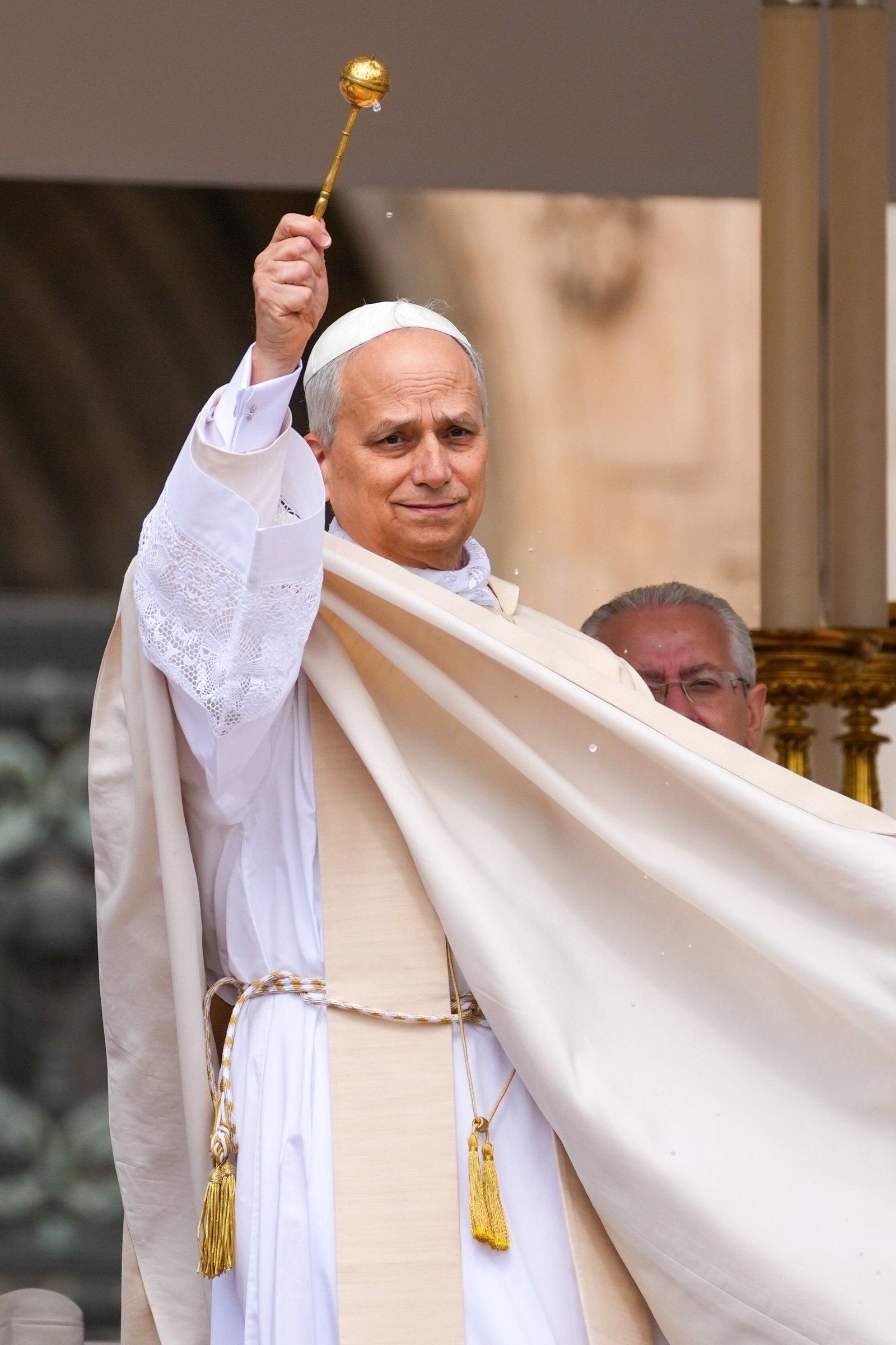 Pope Leo XIV blesses the faithful in St. Peter's Square with holy water at the beginning of his inauguration Mass at the Vatican May 18, 2025. (CNS photo/Lola Gomez)