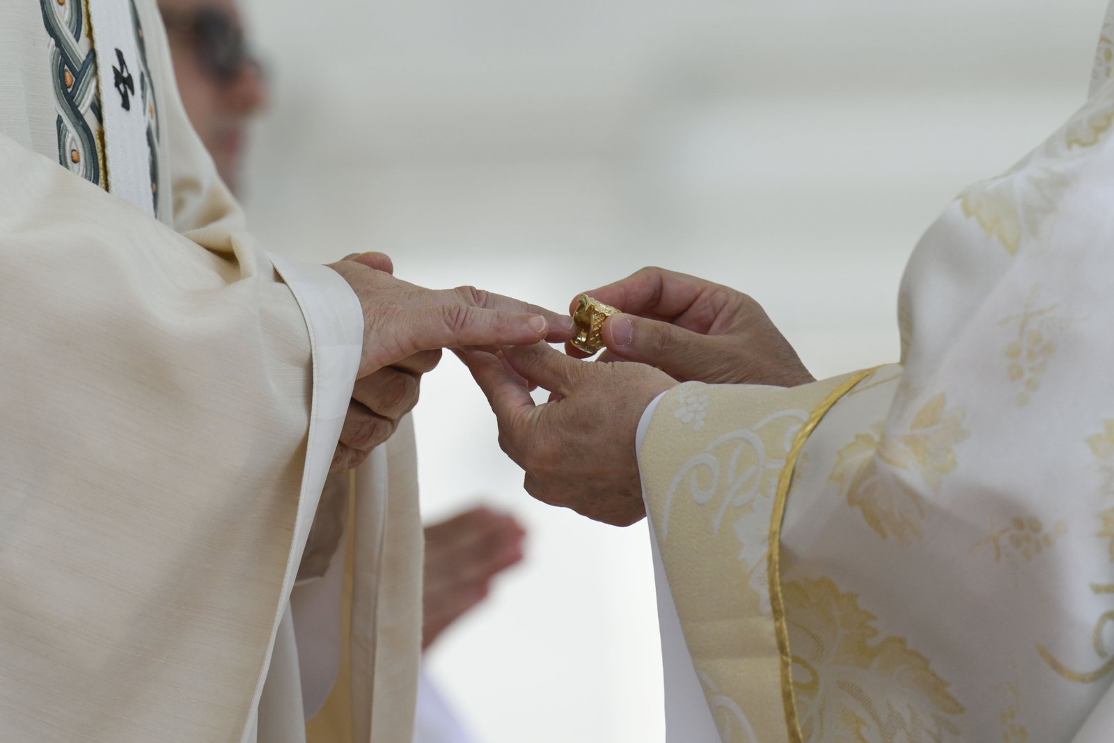 Pope Leo XIV, left, receives the fisherman's ring, symbolizing his role as successor to St. Peter, from Filipino Cardinal Luis Antonio Tagle, right, during the pope's inauguration Mass in St. Peter's Square May 18, 2025. (CNS photo/Vatican Media)