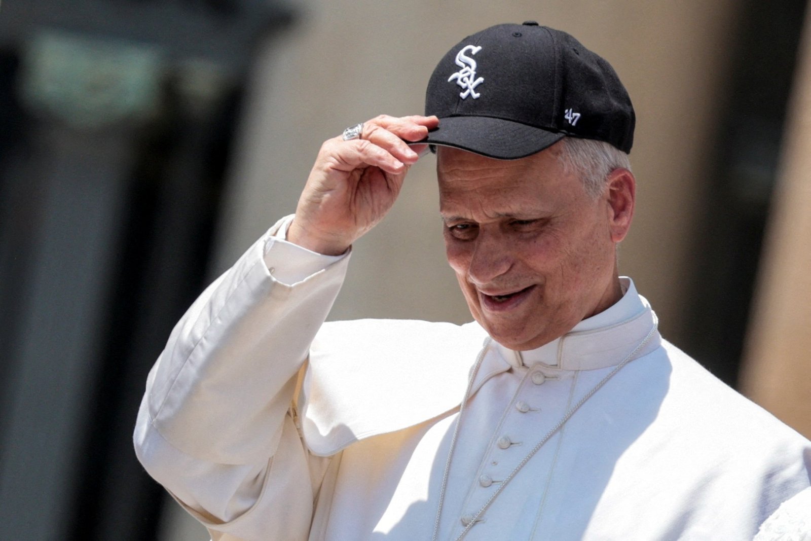 Pope Leo XIV wears a Chicago White Sox baseball cap during his weekly general audience in St. Peter's Square at the Vatican on June 11, a week after signing a baseball for seminarians from Michigan. (OSV News photo/Remo Casilli, Reuters)