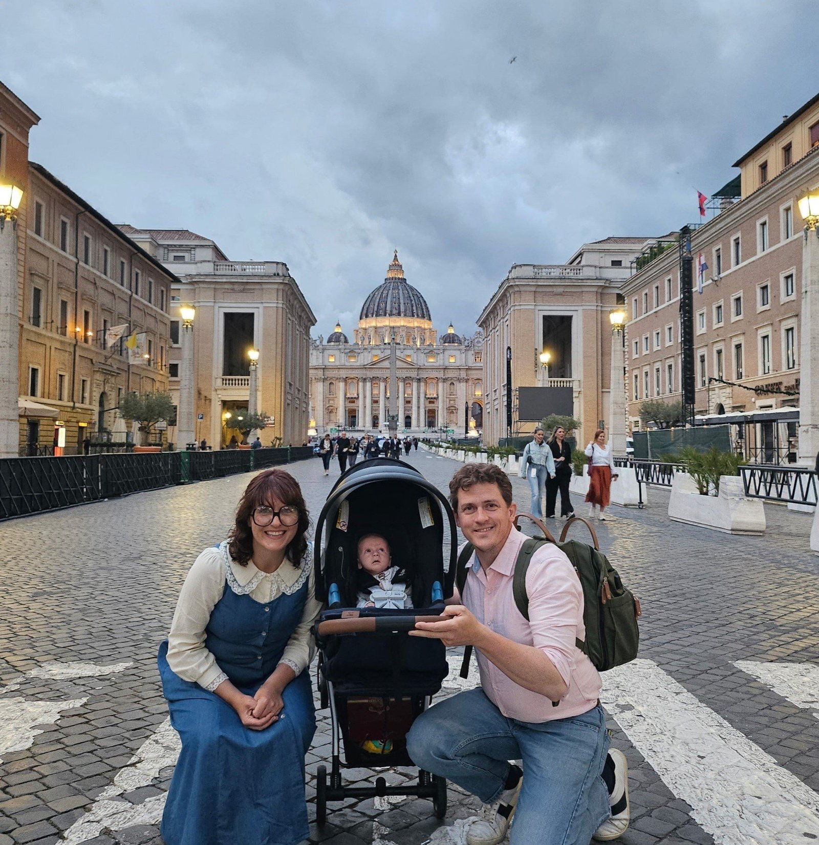 With St. Peter’s Basilica in the background, Arielle and Brandon Brown of Sts. Peter and Paul Cathedral in Indianapolis, pose for a photo with their child, Laurence, during a trip to Rome in May 2025. Pope Leo XIV blessed the child during his first general audience at the Vatican May 21, 2025. (OSV News photo/courtesy Brown family)