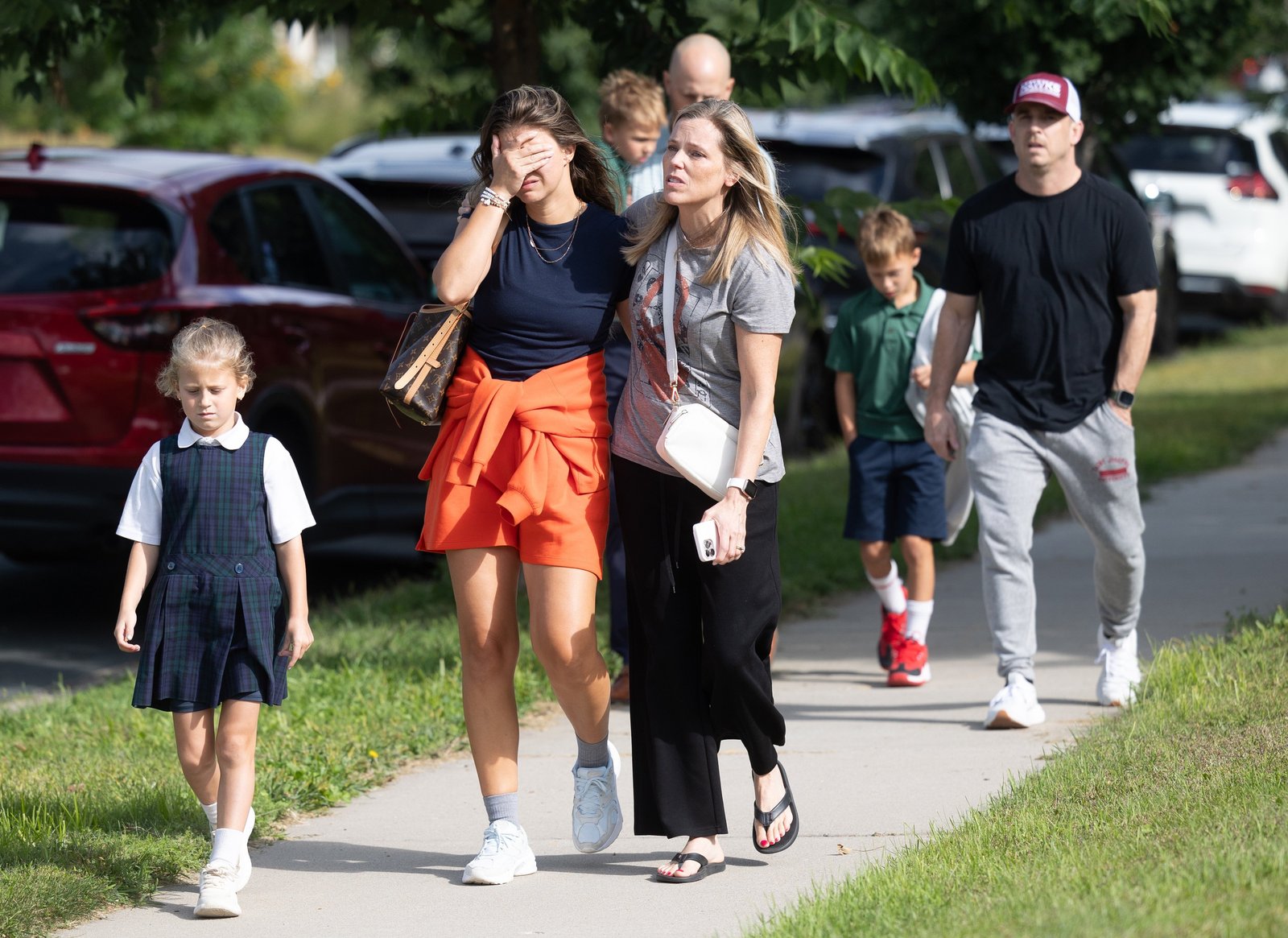 Families and loved reunite following a shooting at Annunciation Catholic School in Minneapolis Aug. 27, 2025. The Richfield Police Department is reporting there are up to 20 victims and the shooter is dead. (OSV News photo/Dave Hrbacek, The Catholic Spirit)