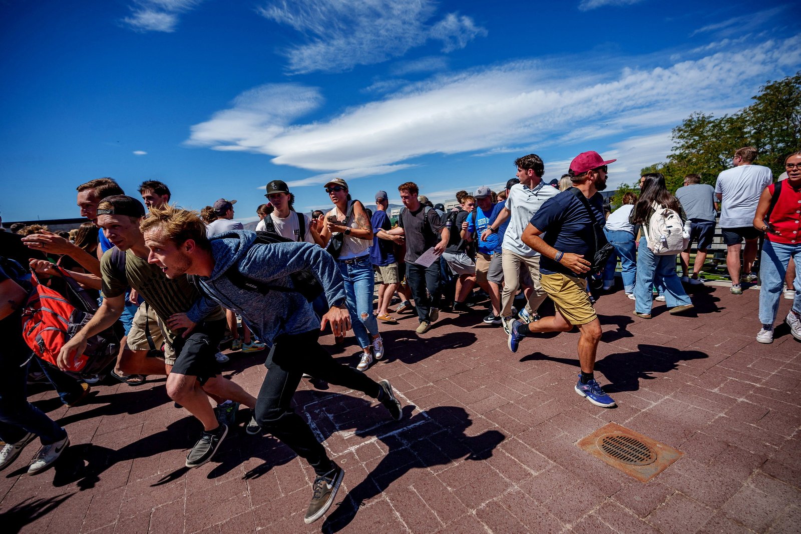 People run after a shot was fired at U.S. right-wing activist and commentator Charlie Kirk during a Utah Valley University speaking event in Orem, Utah, Sept. 10, 2025. (OSV News photo/Trent Nelson, The Salt Lake Tribune via Reuters)