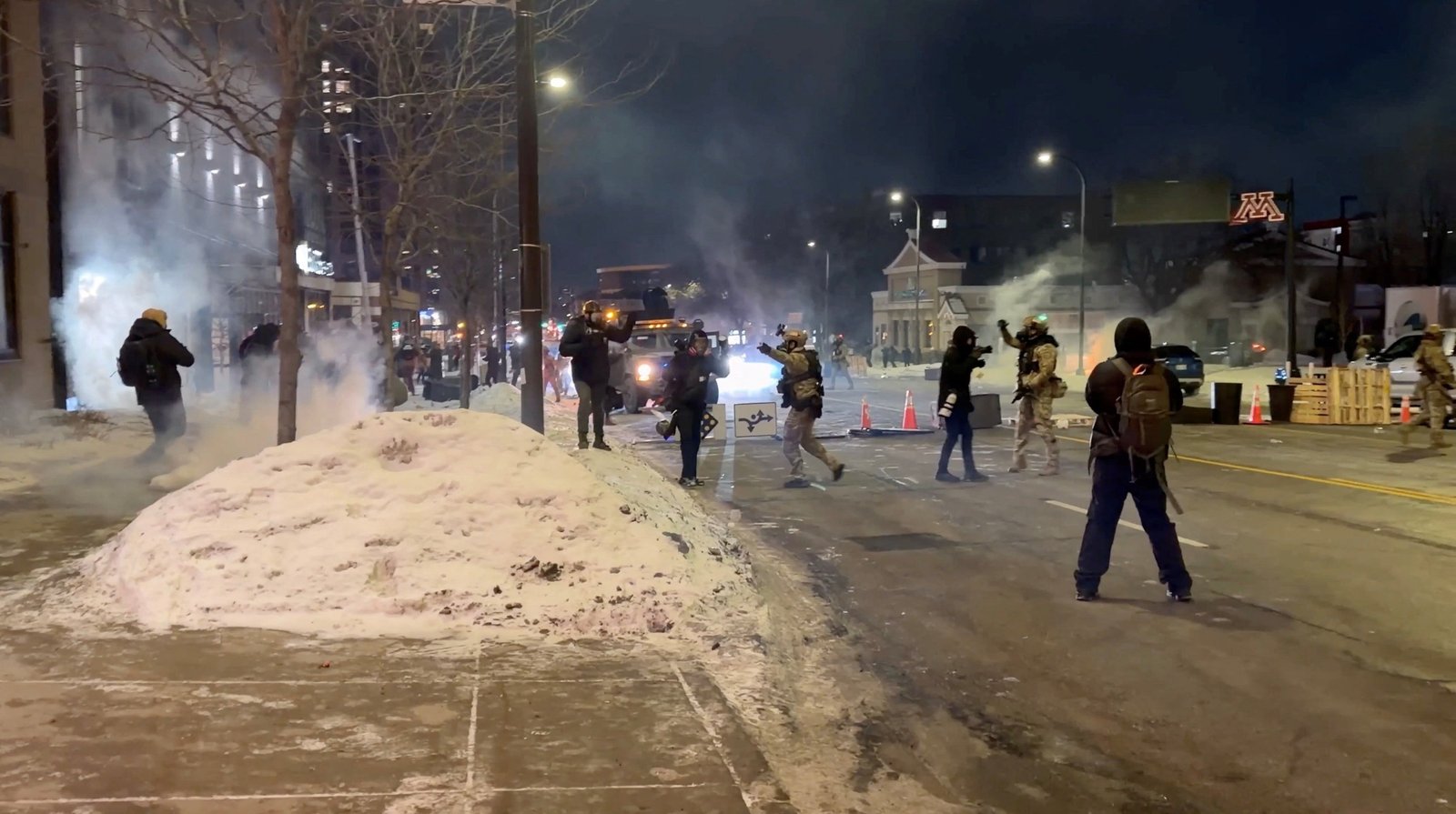 Law enforcement officers deploy tear gas to disperse protestors outside a hotel in Minneapolis, Jan. 25, 2026, after a man was fatally shot by federal agents trying to detain him. The Department of Homeland Security said Alex Pretti, a 37-year-old intensive care unit nurse, had a handgun and approached Border Patrol officers during a targeted operation Jan. 24. (OSV News screen grab/Brendan Gutenschwager via Reuters)