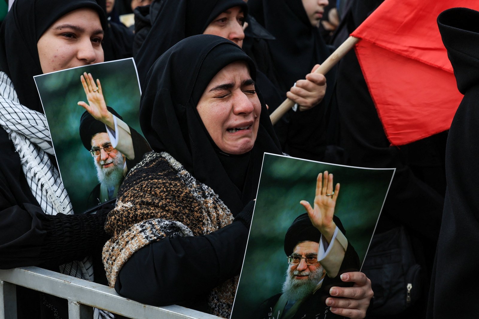 A woman reacts as she holds a placard with an image of Iranian late Supreme Leader Ayatollah Ali Khamenei at a rally in Beirut March 1, 2026, after U.S. and Israeli strikes killed Ali Khamenei Feb. 28. (OSV News photo/Mohamed Azakir, Reuters)