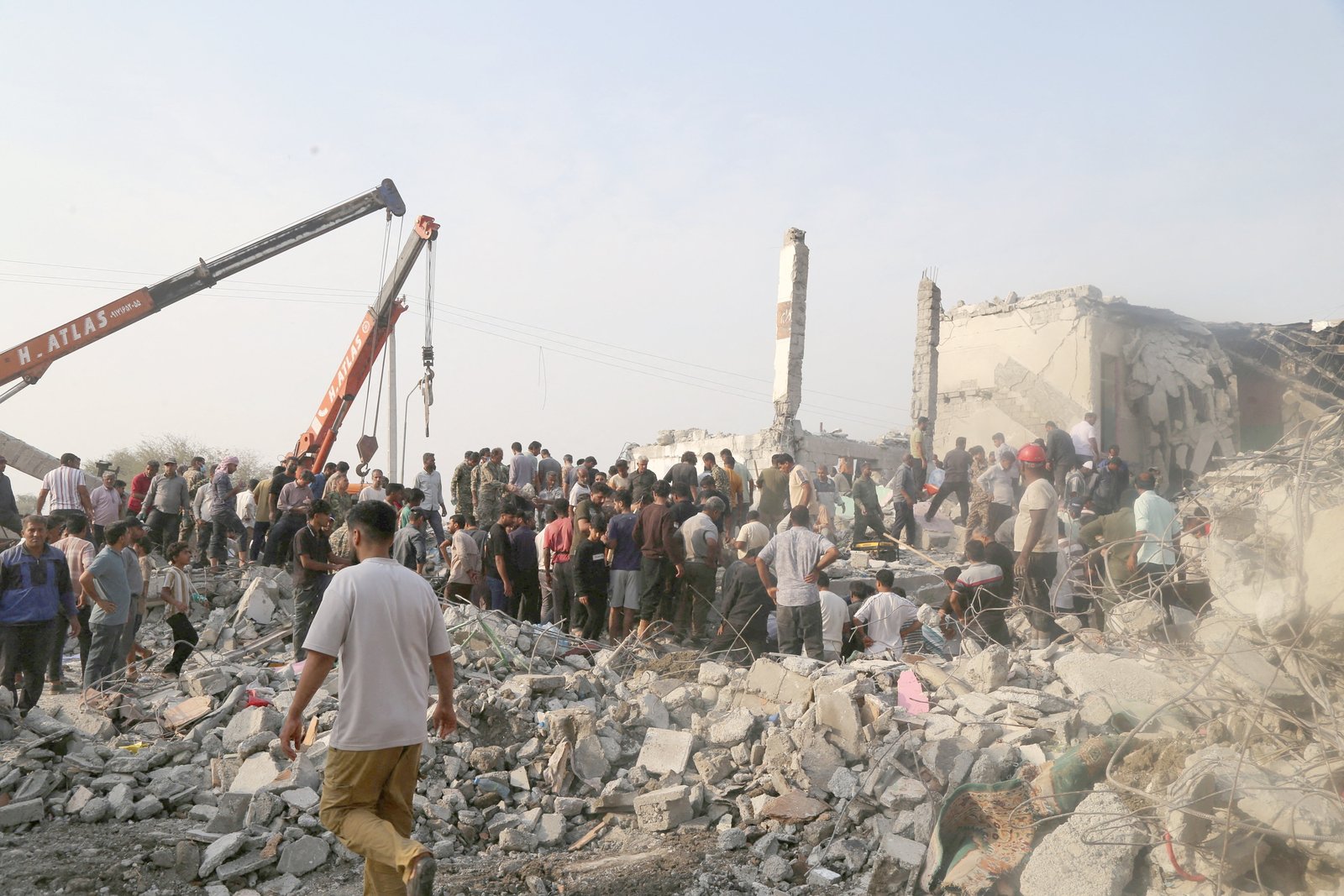 People and rescue forces work following an airstrike on a school in Minab, Iran, Feb. 28, 2026, amid the U.S.-Israeli war with Iran. (OSV News photo/Abbas Zakeri/Mehr News/WANA (West Asia News Agency) via Reuters)