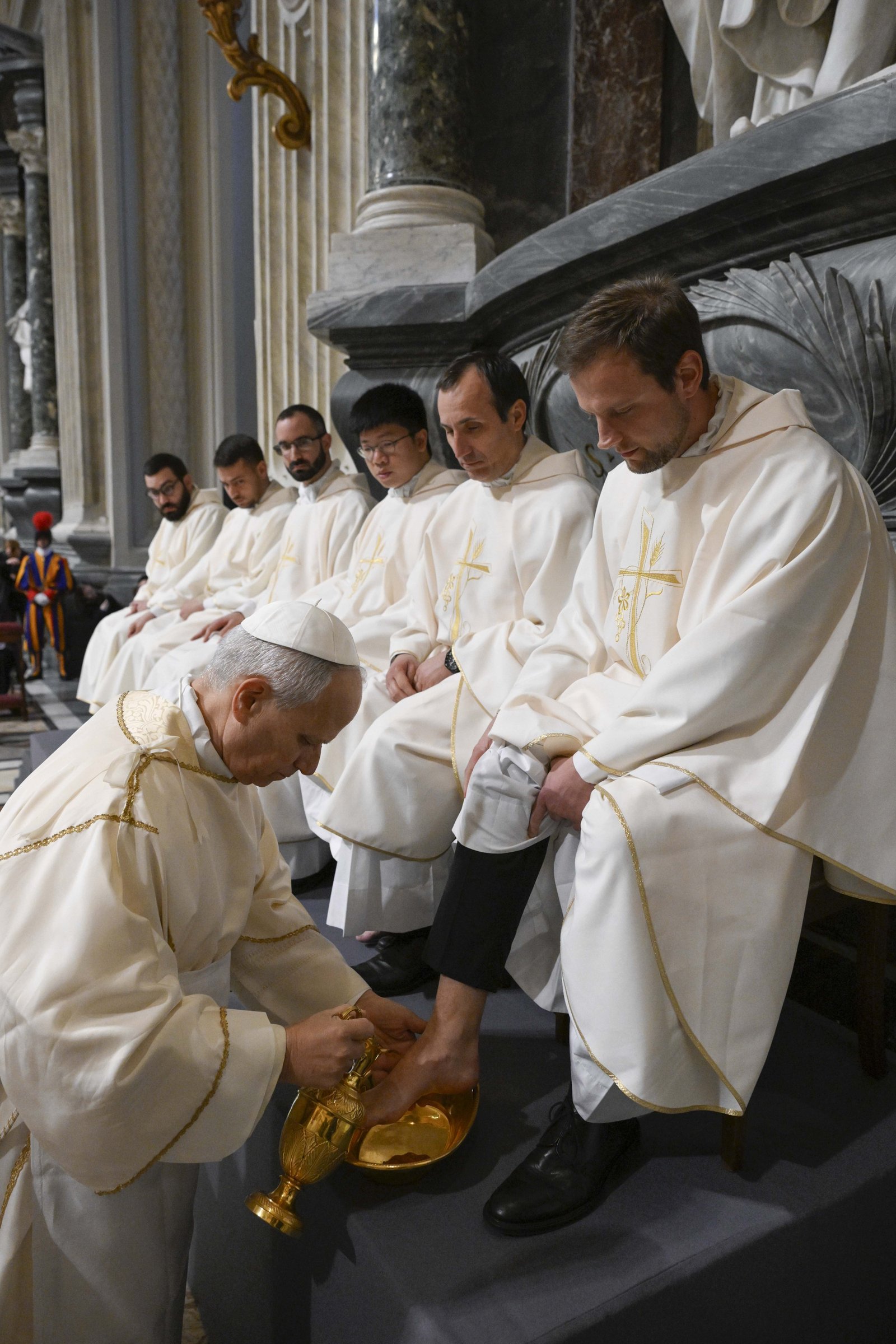 Pope Leo XIV washes the foot of a priest during the Mass of the Lord's Supper at the Basilica of St. John Lateran in Rome April 2, 2026. The foot-washing ritual reflects the call to imitate Christ by serving one another. (CNS photo/Vatican Media)