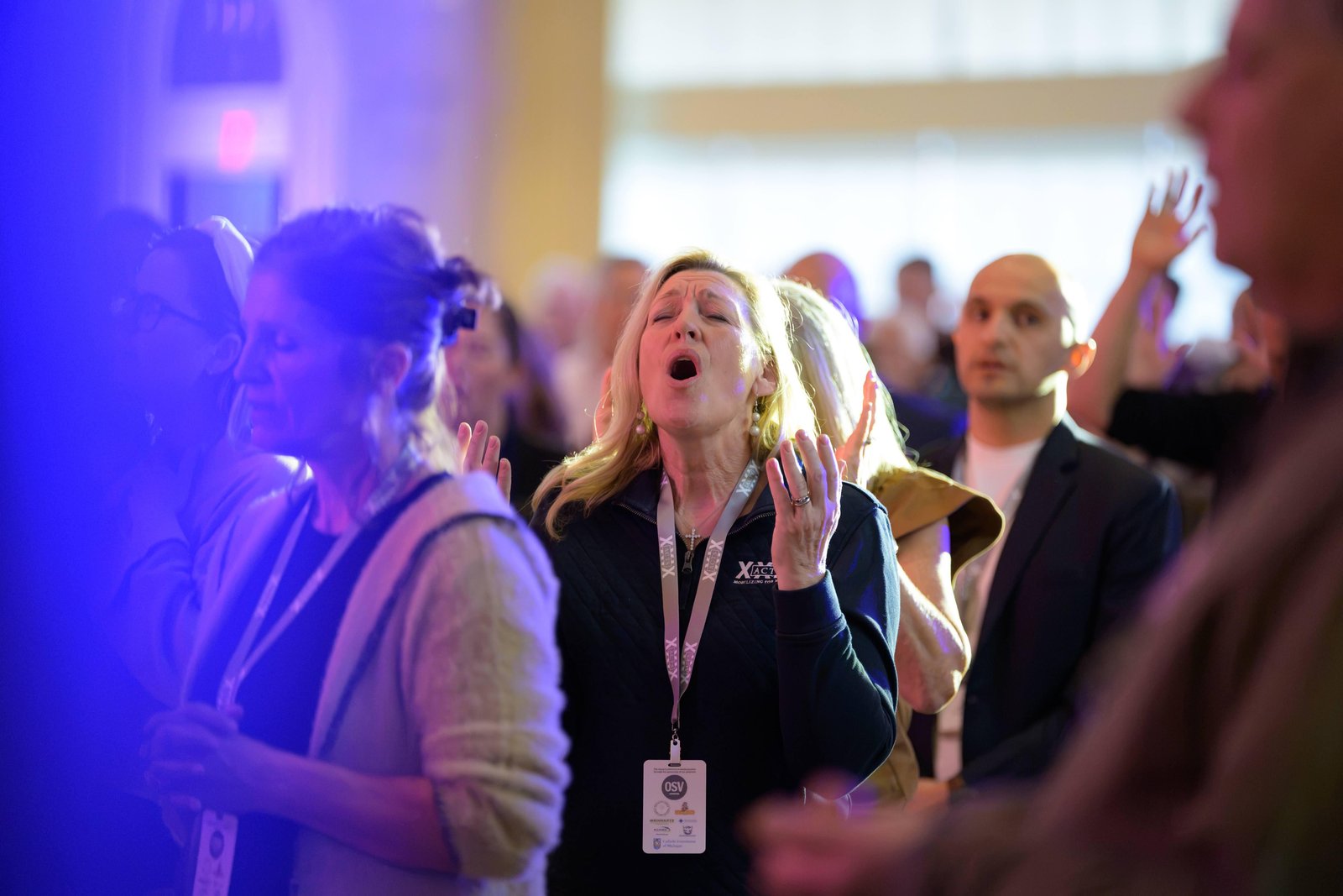 Conference attendees enter into a time of praise and worship through music, fellowship and prayer.