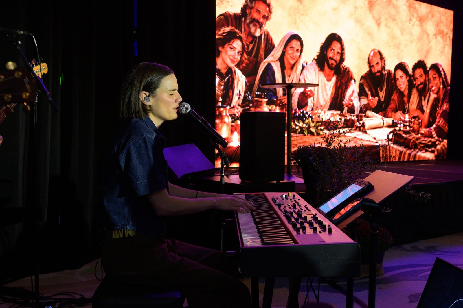 Worship leader and songwriter Sarah Kroger provides musical leadership during the event.