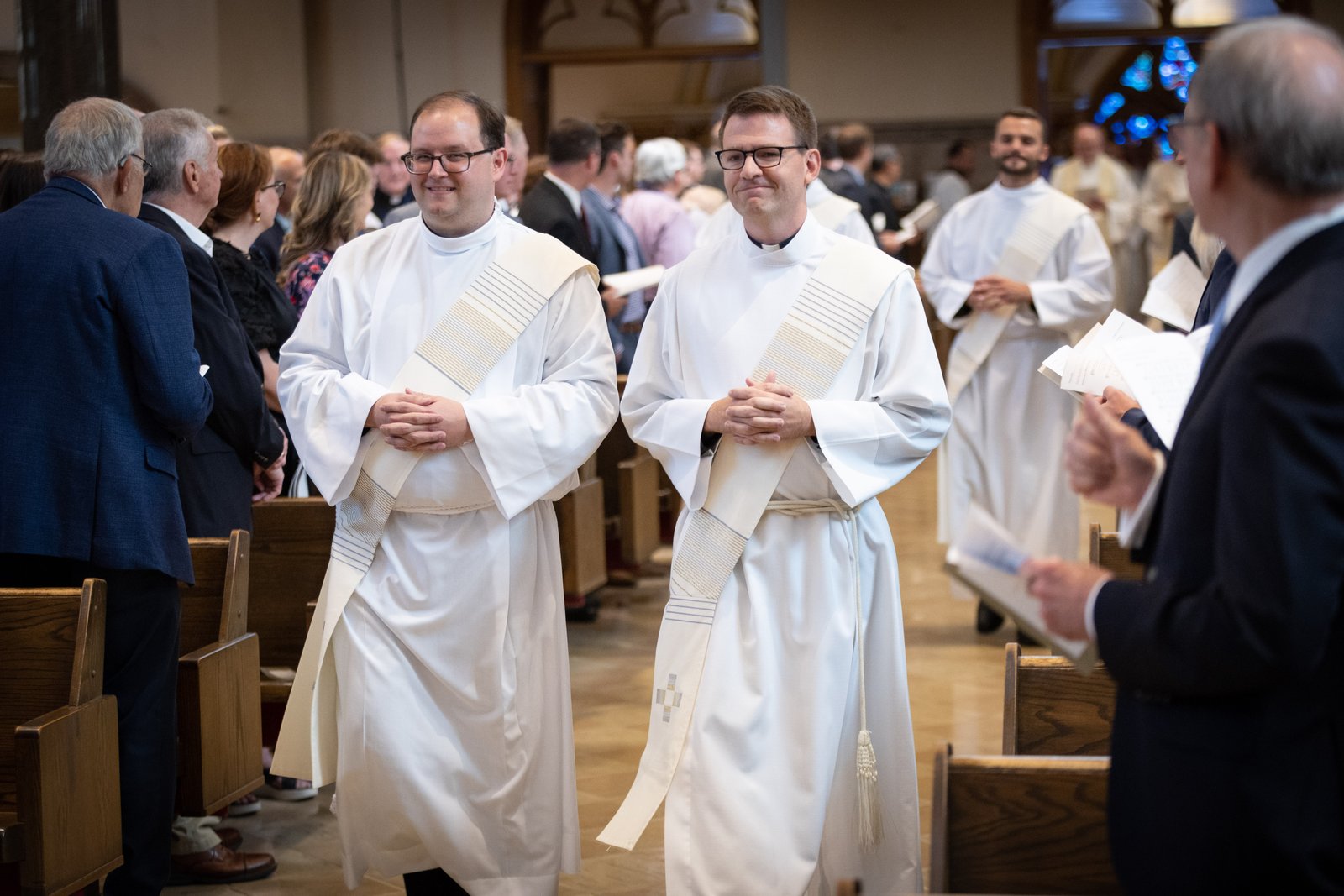 Fr. Daniel J. Dixon, SJ, right, processes next to Fr. Daniel J. Kennedy, SJ, during their ordination Mass for the Society of Jesus on June 10, 2023. Fr. Dixon is a U of D Jesuit alum, Class of '06, who will return to his alma mater to be the school's next president.