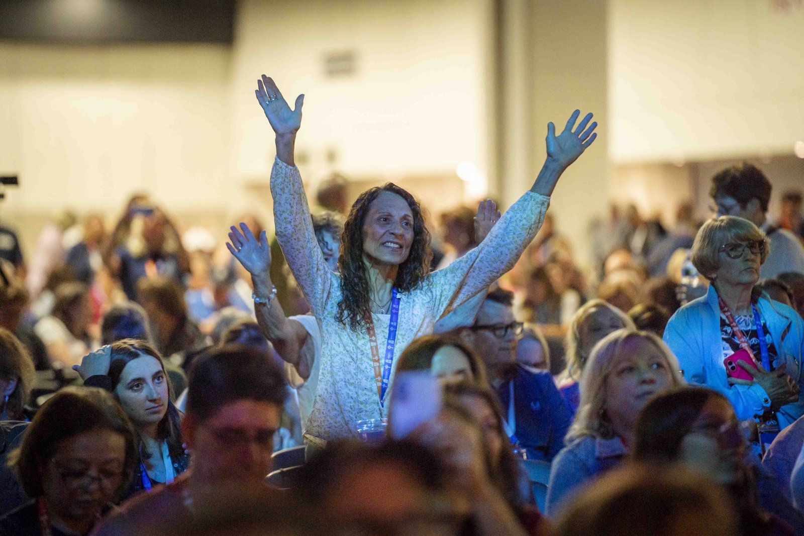 Worshippers raise their hands in praise during the Eucharistic revival. (Valaurian Waller | Detroit Catholic)