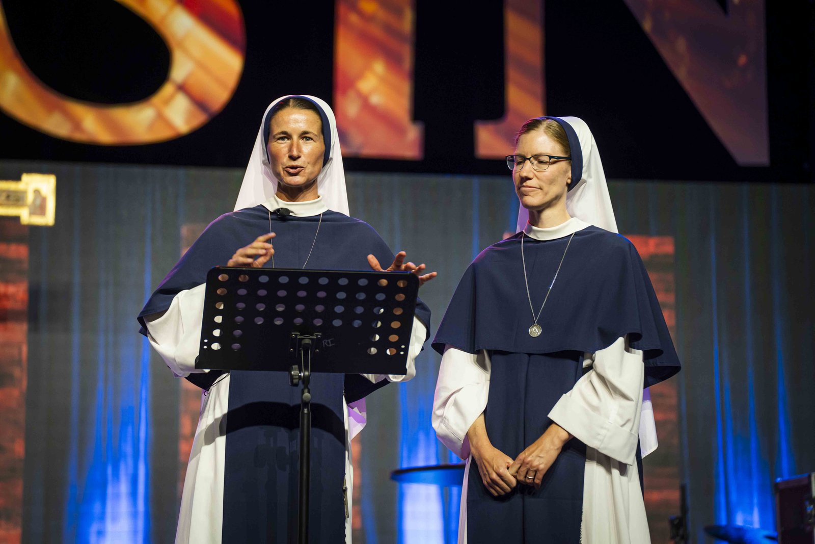 Sr. Mary Grace, left, of the New York-based Sisters of Life, opened the afternoon by speaking about the healing power of the Eucharist and how Christ’s presence in the Holy Sacrifice of the Mass is a testament to God's love for His creation. (Valaurian Waller | Detroit Catholic)