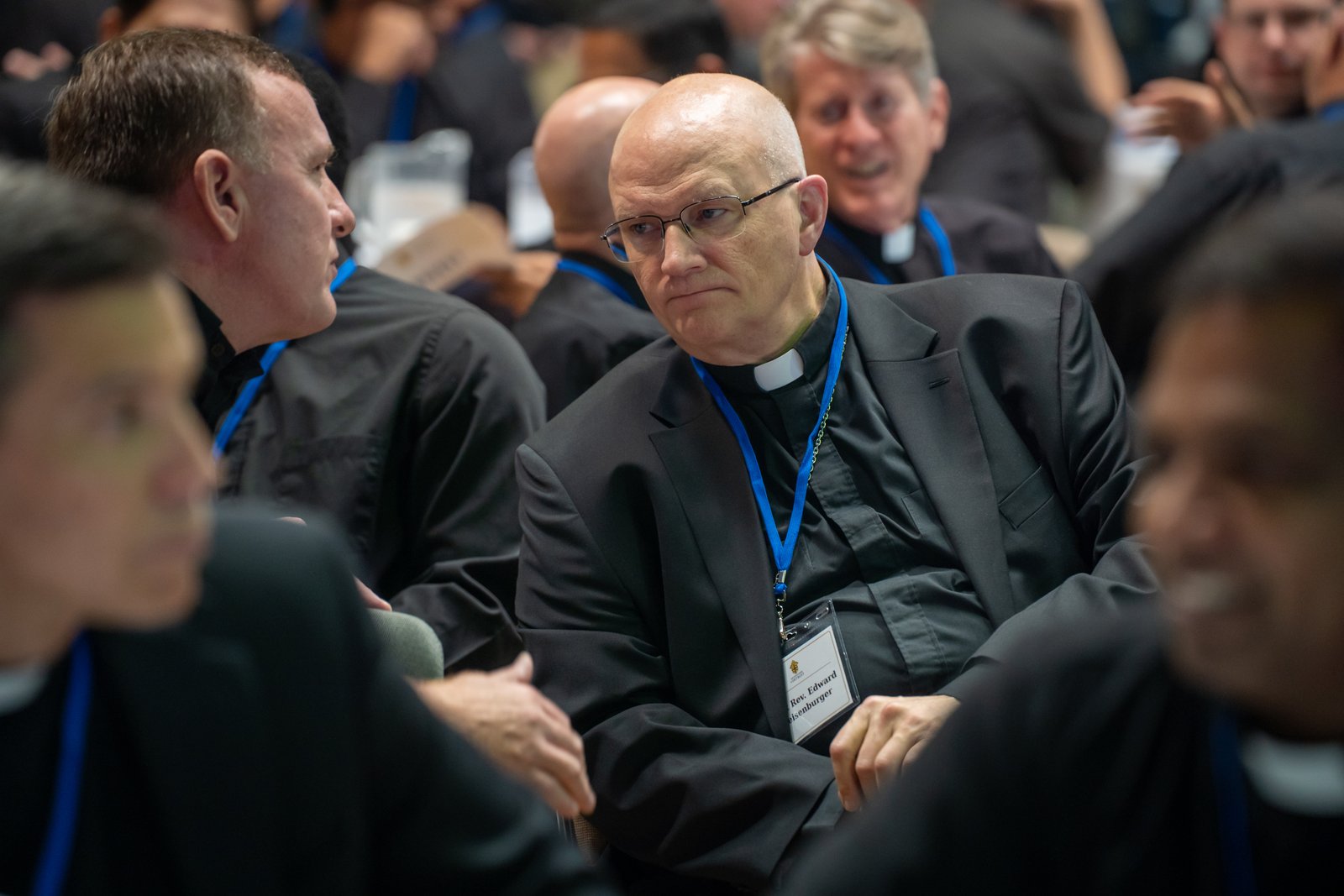 Archbishop Edward J. Weisenburger listens to a priest during a meeting in September at Sacred Heart Major Seminary related to the archdiocesan restructuring process. The archbishop said he understands the challenges being asked of priests during the restructuring, and lauded their faithful leadership, unity and service. (Valaurian Waller | Detroit Catholic)
