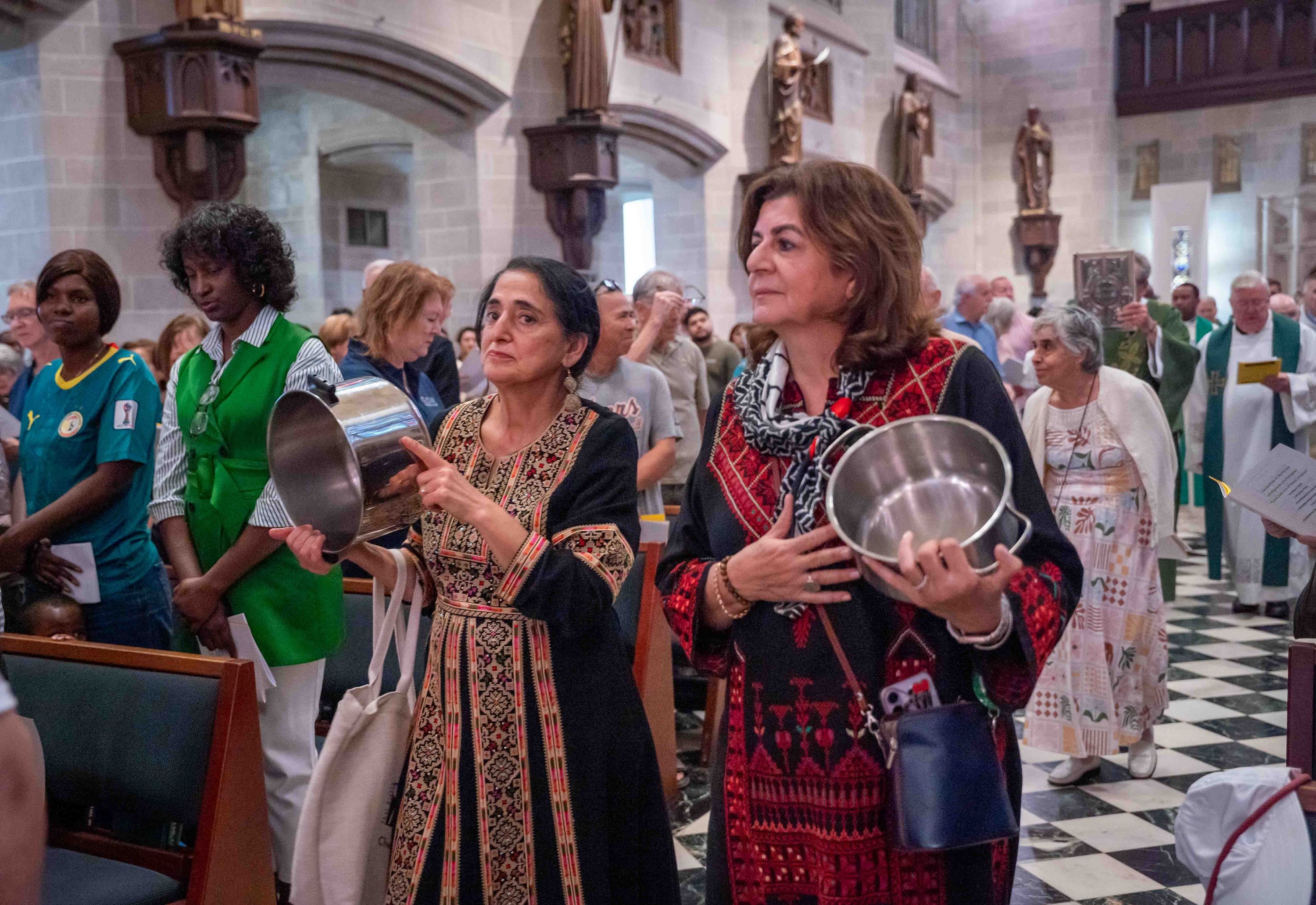 https://img.hghlnd.com/imgix/https://detroitcatholic.nyc3.digitaloceanspaces.com/261004_Strangers_No_Moss_Immigration_Mass_dc_vw-11.JPG