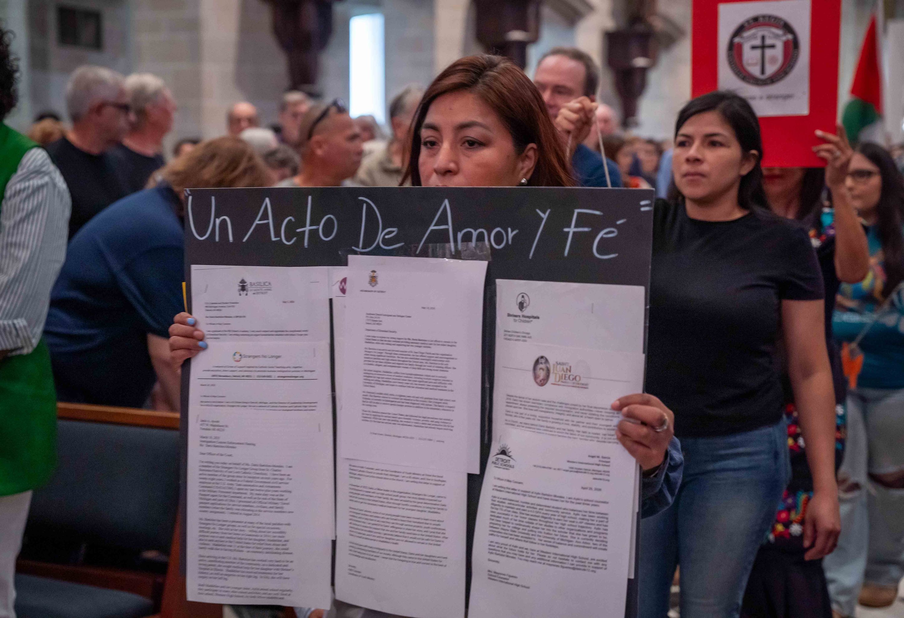 https://img.hghlnd.com/imgix/https://detroitcatholic.nyc3.digitaloceanspaces.com/261004_Strangers_No_Moss_Immigration_Mass_dc_vw-9.JPG
