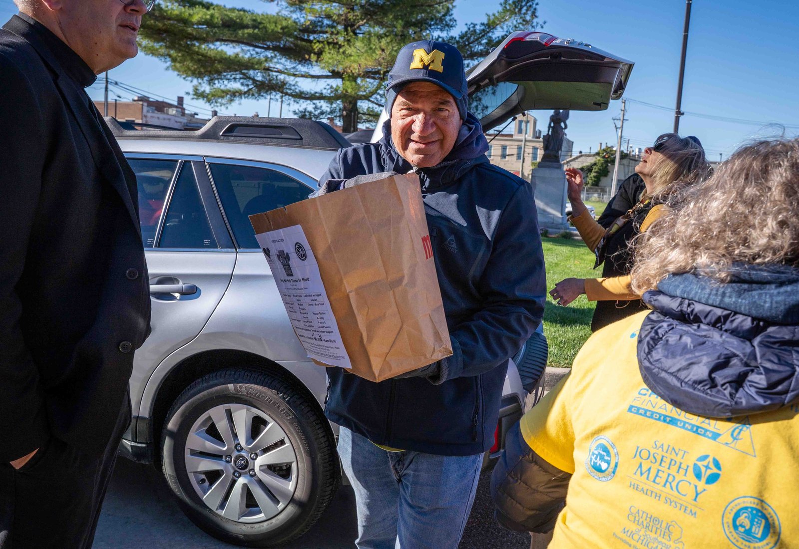 Food and toiletries donations were dropped off curbside for 75 volunteers to organize and sort prior to distribution. (Valaurian Waller | Detroit Catholic)