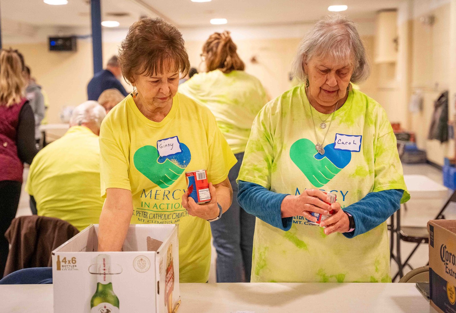 Volunteers check and organize donated goods by food group and destination, prior to food being distributed across partner organizations. (Valaurian Waller | Detroit Catholic)