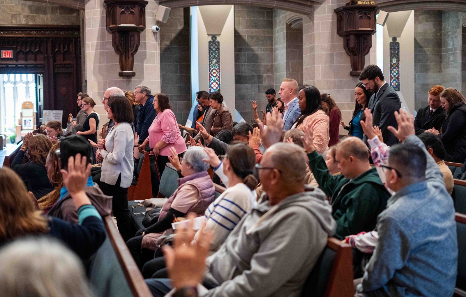 Couples who had lost a child or were hoping to conceive were invited to stand, and the congregation extended arms over them as a blessing was offered.