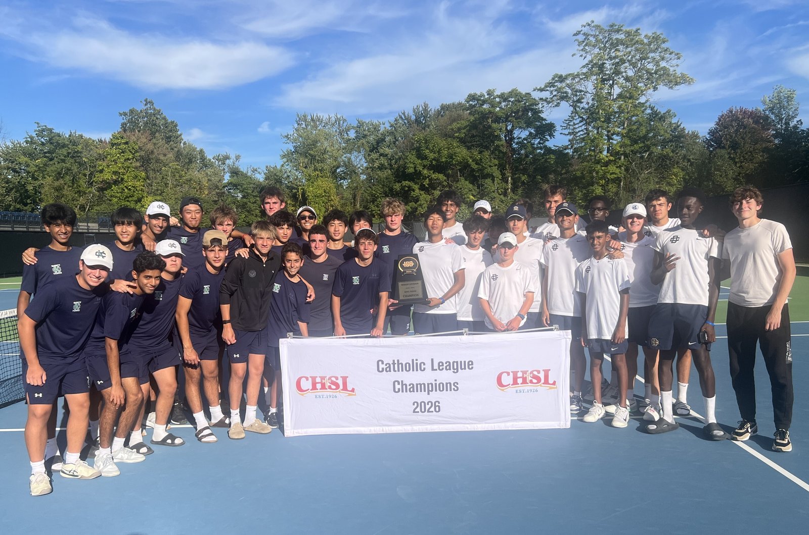 It was all even-steven for Cranbrook (in blue) and Country Day (in white) as they each tied for the top spot in the Catholic League’s Bishop Division tennis tournament. The Cranes and the Yellowjackets had 18 points apiece to lead the seven-team field Sept. 26.
