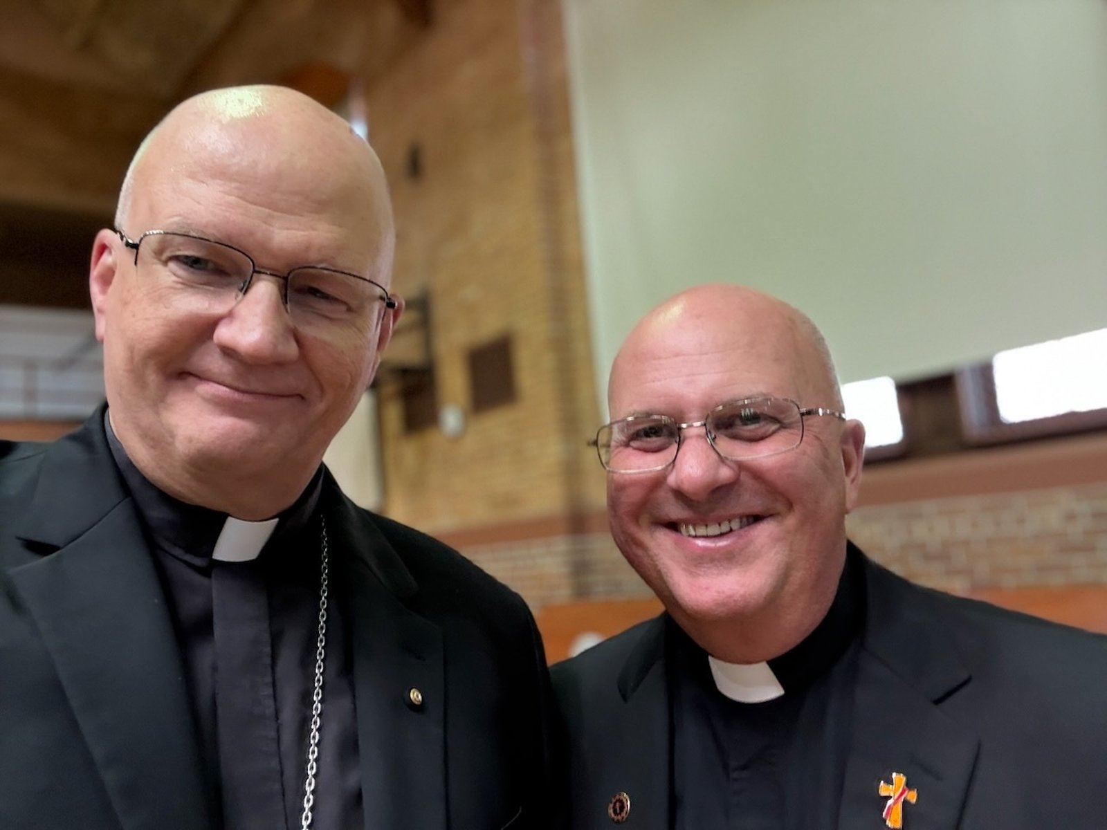 Archbishop Weisenburger smiles with Deacon John Kovacik after the ordination Mass.
