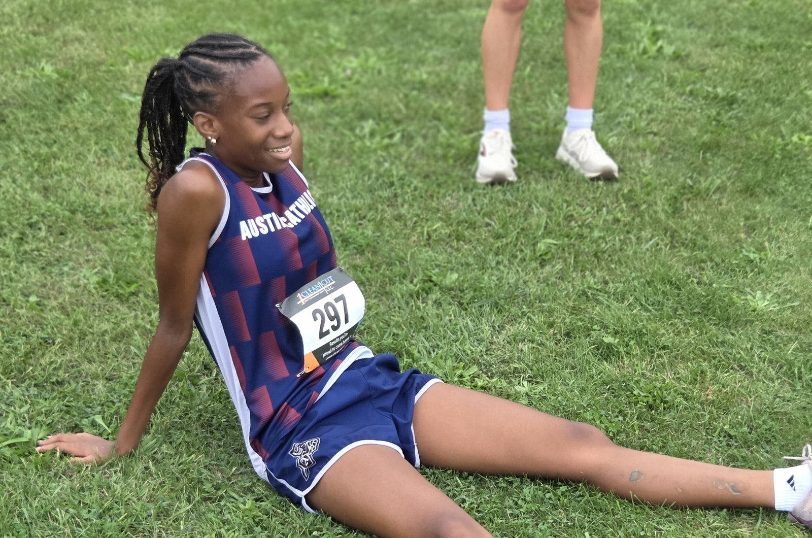 After winning the Catholic League’s first Cardinal Division jamboree on the grounds of Fort Wayne in Detroit, Austin Catholic’s Cassidy Bowers takes a moment to catch her breath.
