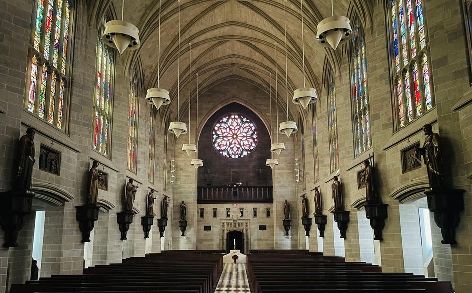 The statues, pictured in their final fixed locations above the cathedral's pillars, are just one piece of an ever-developing project to turn the cathedral into a true apostolic center in the heart of Detroit, Fr. Mech said.