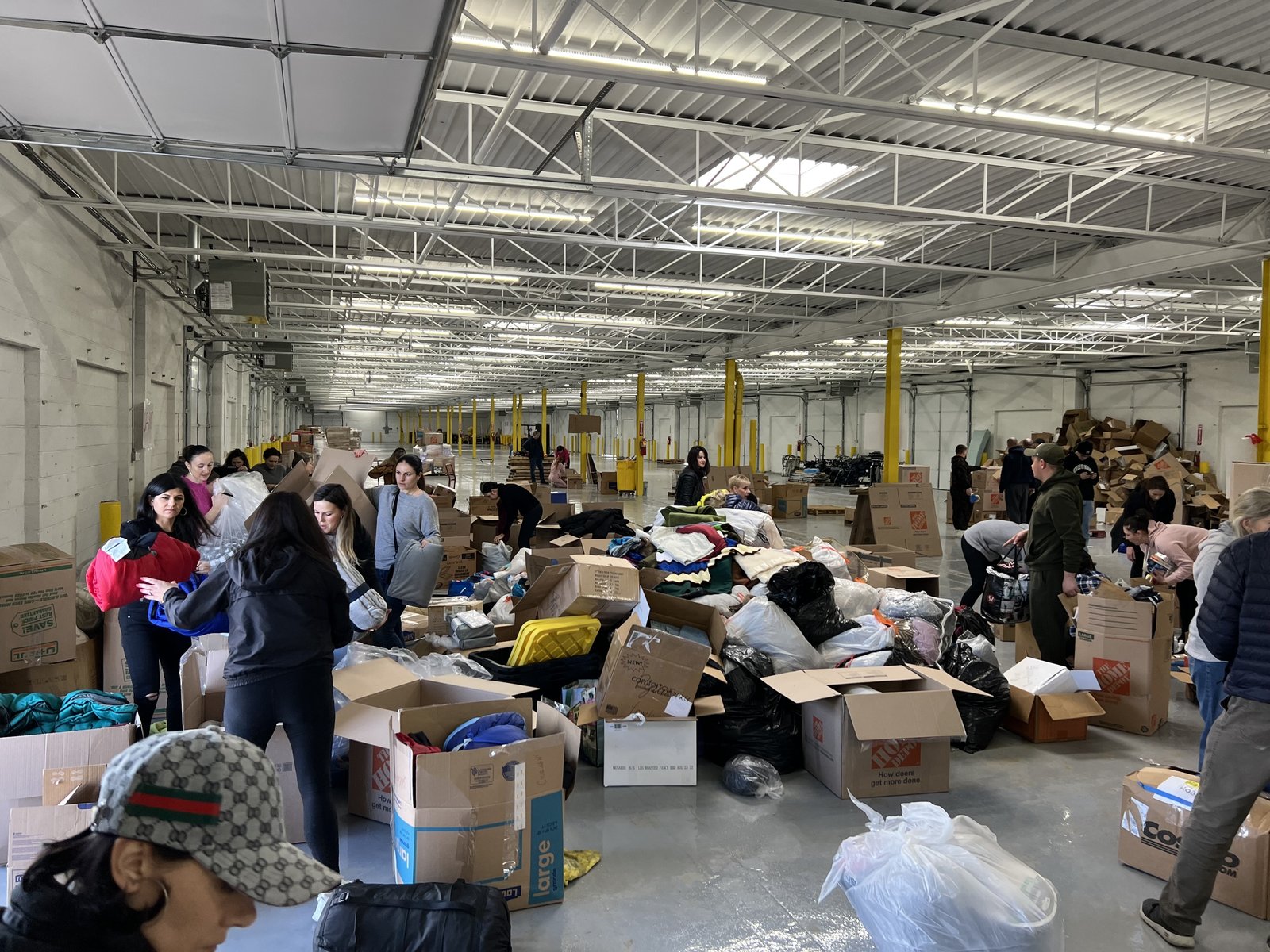 Standard Trucking, a Ukrainian-owned business in Hamtramck, has become a central hub collecting donated supplies for Ukraine. The company brings in volunteers to organize the items, and then ships them to Poland, where they are either sent across the Ukrainian border or distributed to refugees in need. (Photo courtesy of Nazarii Semchyshyn)