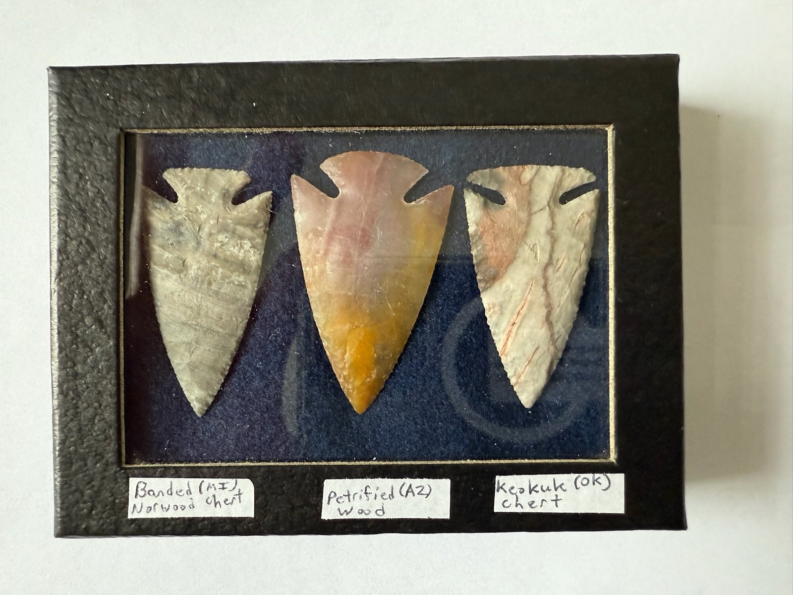 Mike Cook, a "flintknapper" from Portland, Michigan, who creates arrowheads for jewelry and hunting, crafted three arrowheads to present as a gift to Archbishop Edward J. Weisenburger after seeing an arrowhead represented on the archbishop's coat of arms. In heraldry, an arrowhead pointed downward is a sign of peace.

Cook created the three arrowheads to represent three stops in the archbishop's ministry: the arrowhead on the left is crafted from Banded Norwood Chert (from Michigan); the arrowhead in the middle is made of Petrified Wood (from Arizona); and the arrowhead on the right is created from Keokuk Chert (from Oklahoma).