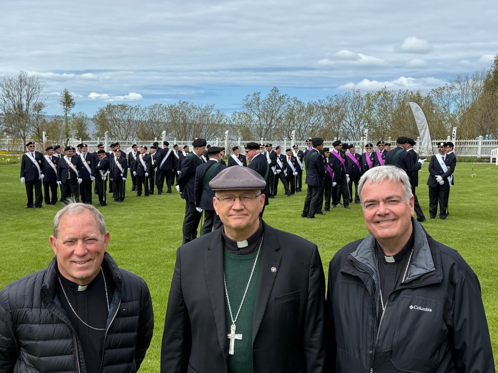 Archbishop Weisenburger, Saginaw Bishop Robert D. Gruss, left, and Detroit Auxiliary Bishop Robert J. Fisher line up for the living rosary with the Knights of Columbus.
