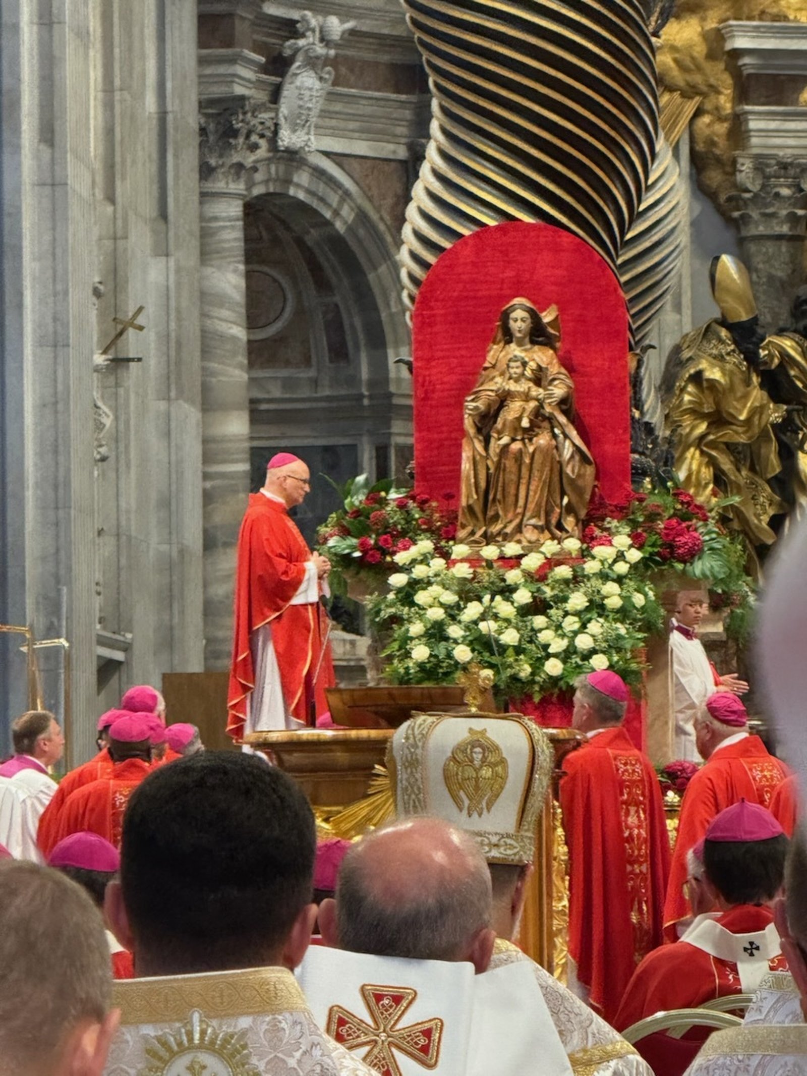 Archbishop Weisenburger waits to receive his pallium from Pope Leo XIV at St. Peter's Basilica.