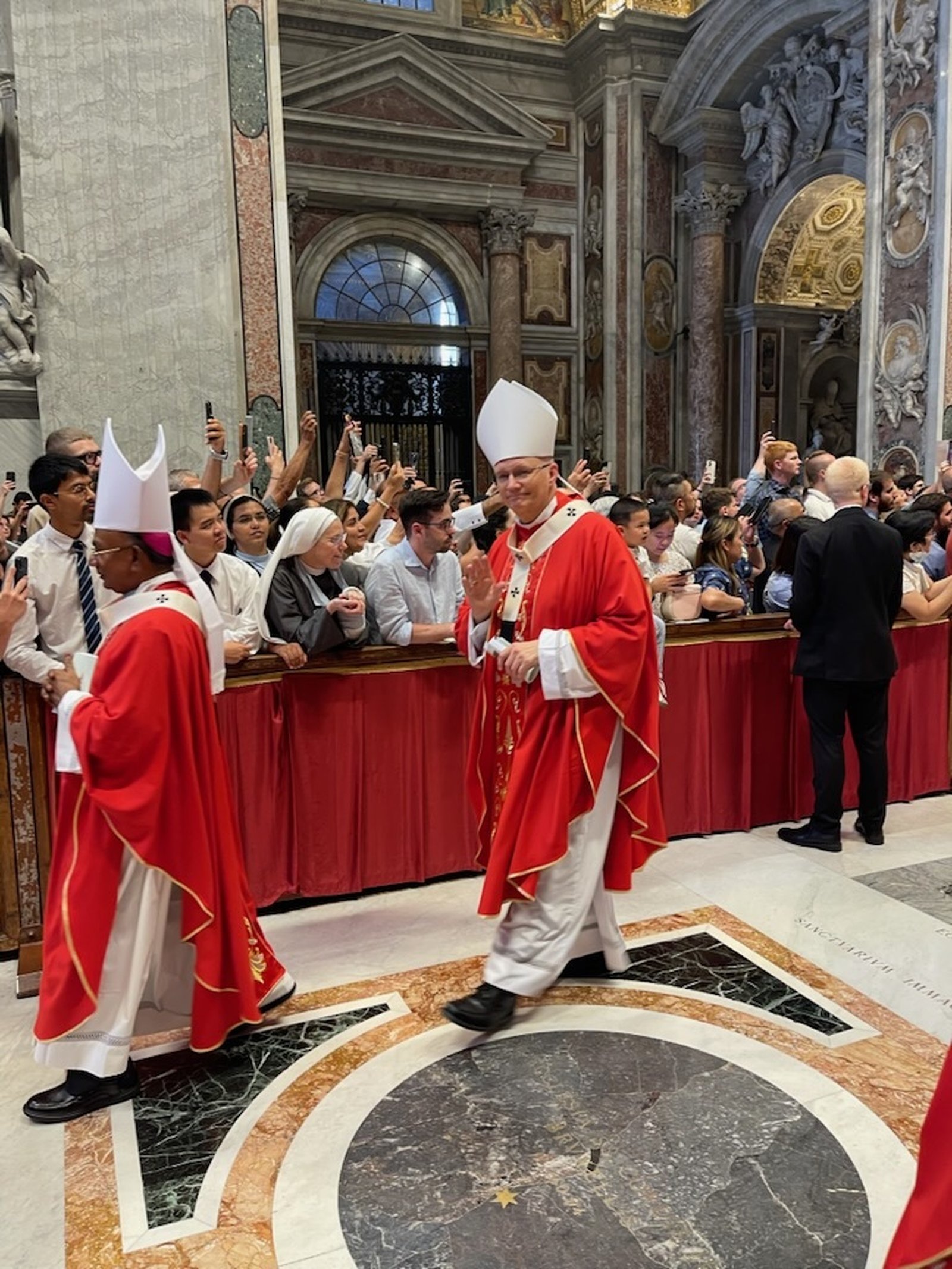 Archbishop Weisenburger smiles while wearing his pallium at the close of the Mass at St. Peter's Basilica.